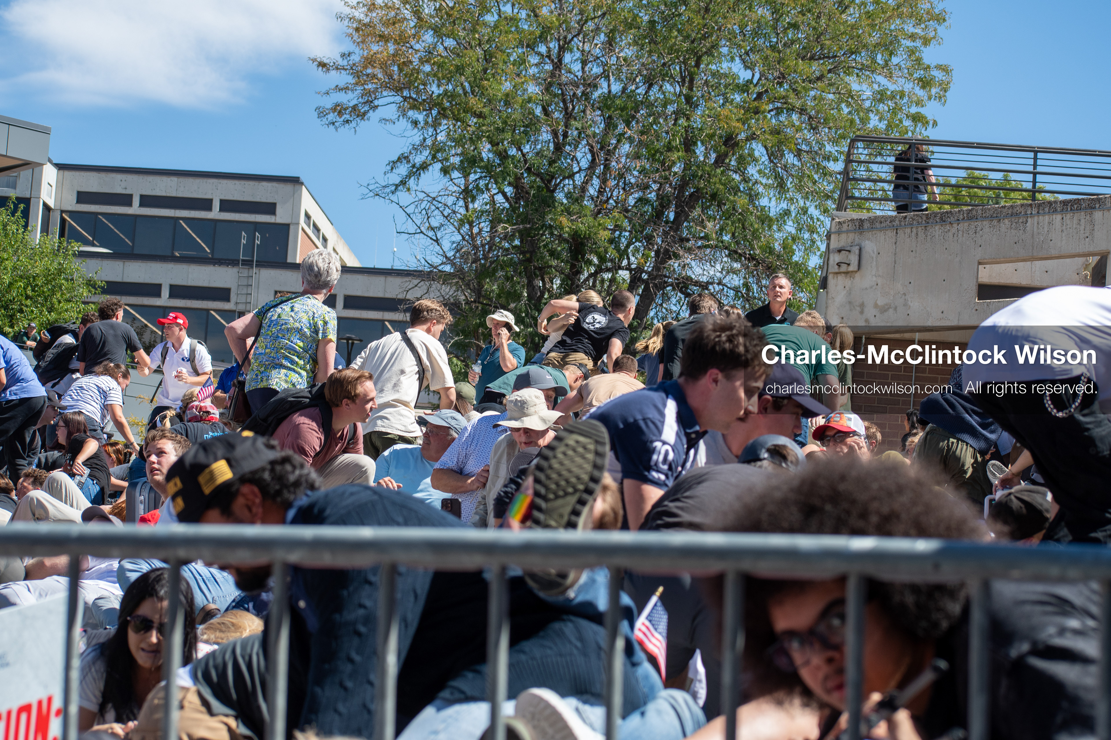 September 10, 2025, Orem, Utah, USA: Attendees duck for cover moments after a gunshot is fired during a public event at Utah Valley University, where conservative activist Charlie Kirk is shot during a Q&A session with students. The shooting prompts immediate panic and a rapid evacuation as law enforcement begins securing the area. (Credit Image: © Charles-McClintock Wilson/ZUMA Press Wire)