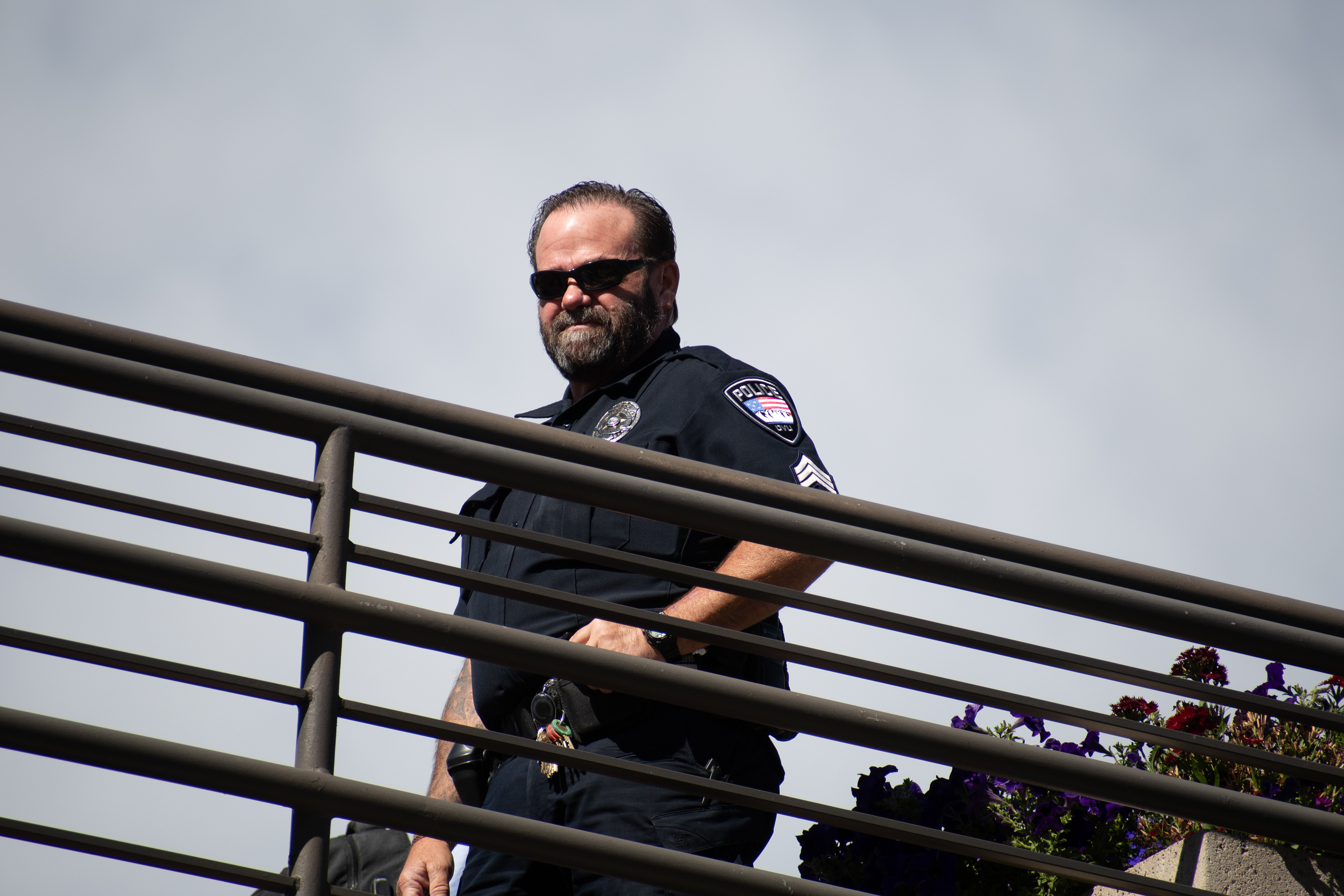 September 10, 2025 – Orem, Utah, United States: A Utah Valley University police officer maintains a security post on an elevated walkway ahead of a scheduled public event featuring conservative activist Charlie Kirk. Photograph by Charles‑McClintock Wilson / ZUMA Press Wire