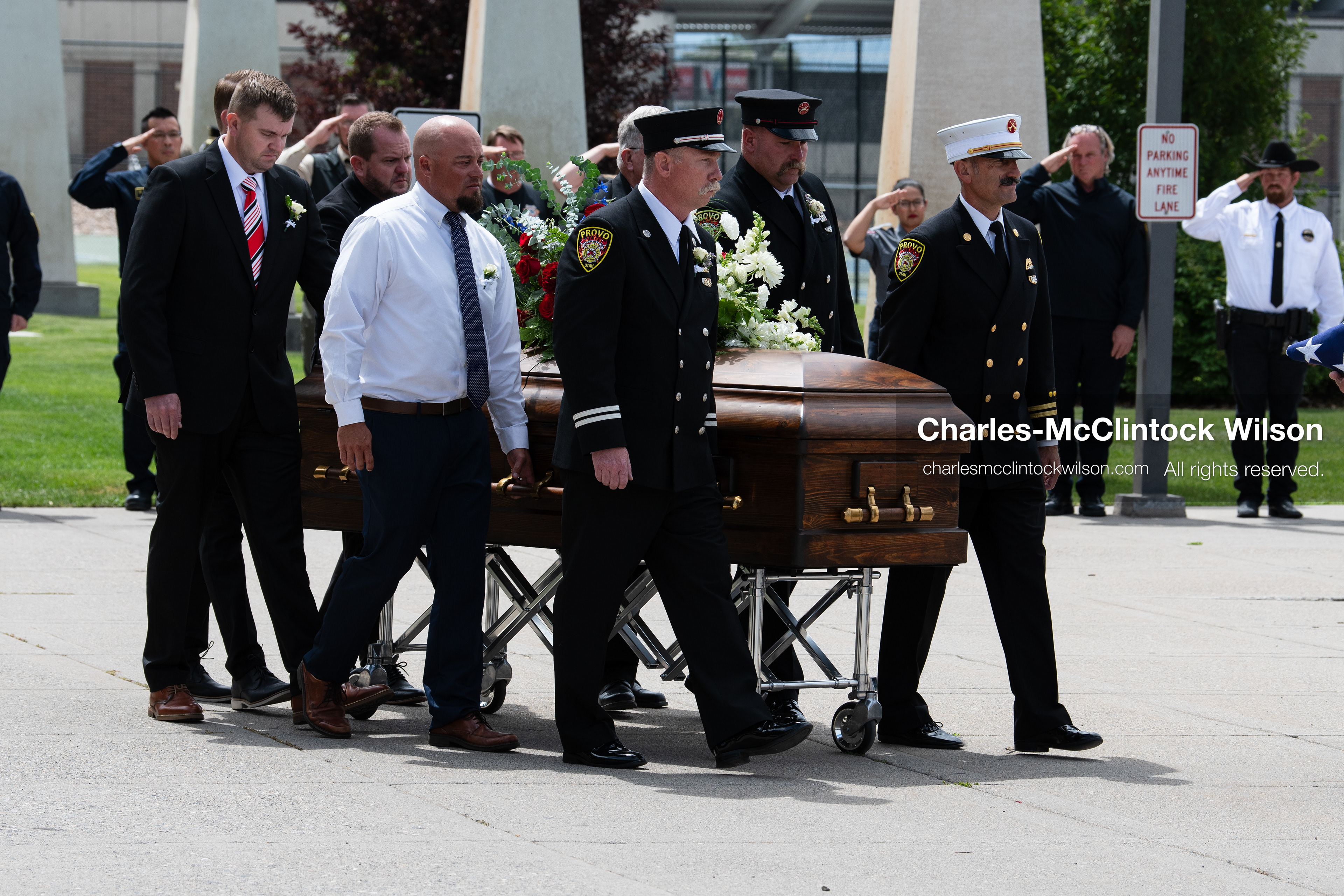Firefighters and pallbearers escort the casket of Provo Fire Captain Spencer Long outside the UCCU Center on the campus of Utah Valley University in Orem, Utah, on Wednesday, July 29, 2026. More than 300 people came to the public memorial ceremony to honor Captain Long, his wife Katrina, and three of their sons, who died after a flash flood hit their campsite near the Sunglow Campground in Wayne County. (Photo by Charles-McClintock Wilson/Sipa USA)