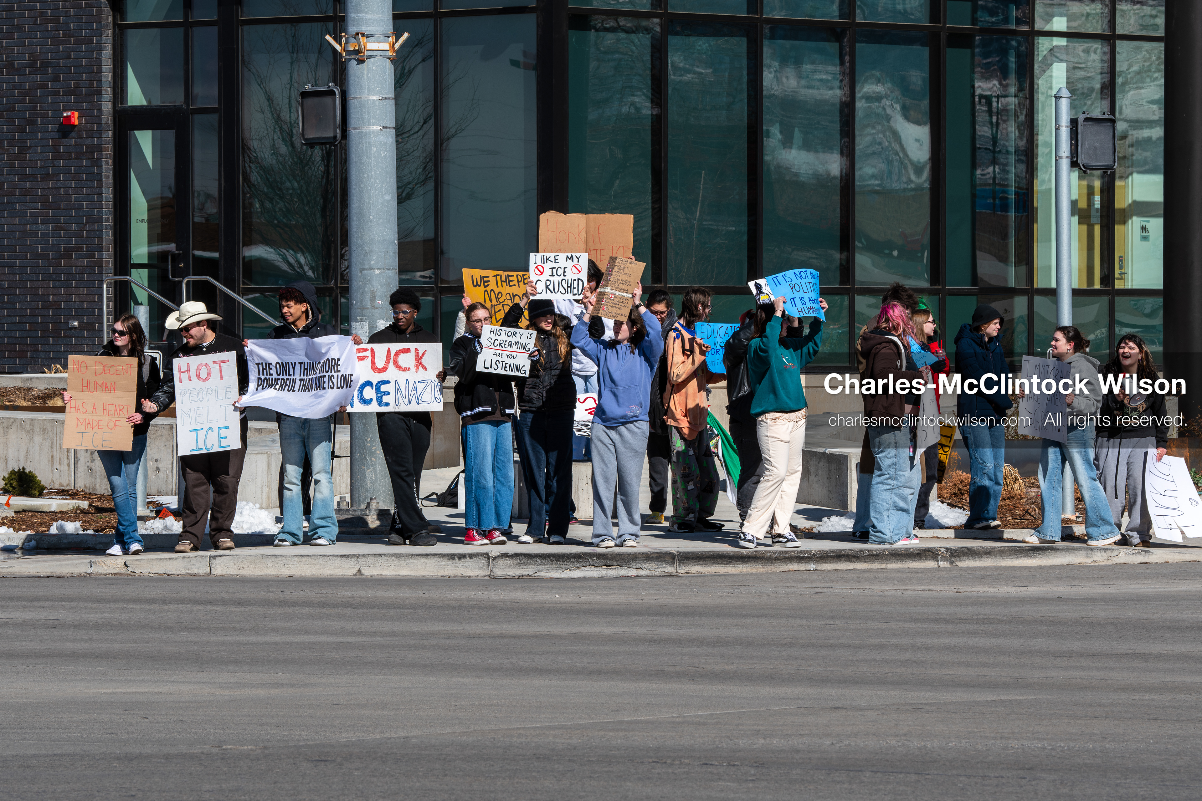 February 20, 2026, Orem, Utah, USA: High school students gather along State Street in front of Orem City Hall during a student led protest against ICE and federal immigration enforcement. Demonstrators hold signs as they stand near the roadway while traffic continues through the area. (Credit Image: © Charles McClintock Wilson/ZUMA Press Wire)