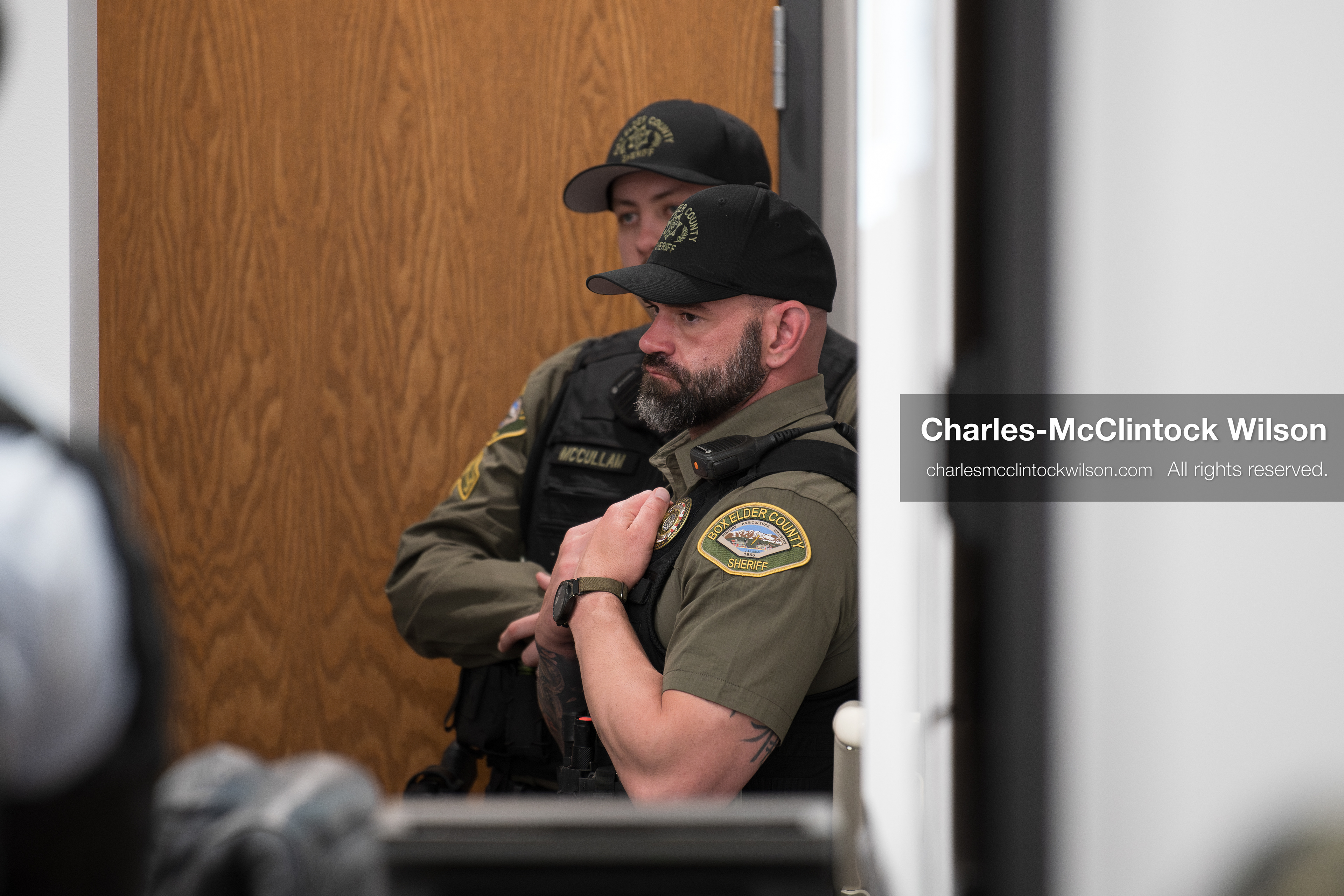 May 13, 2026, Brigham City, Utah, USA: Two Box Elder County Sheriff’s Office deputies stand near a doorway inside the Box Elder County Justice Center in Brigham City, Utah, as residents gather for a public meeting over the proposed data‑center project backed by businessman Kevin O’Leary, which has drawn public concern over water use, power demand, and transparency. (Credit Image: © Charles‑McClintock Wilson/ZUMA Press Wire)