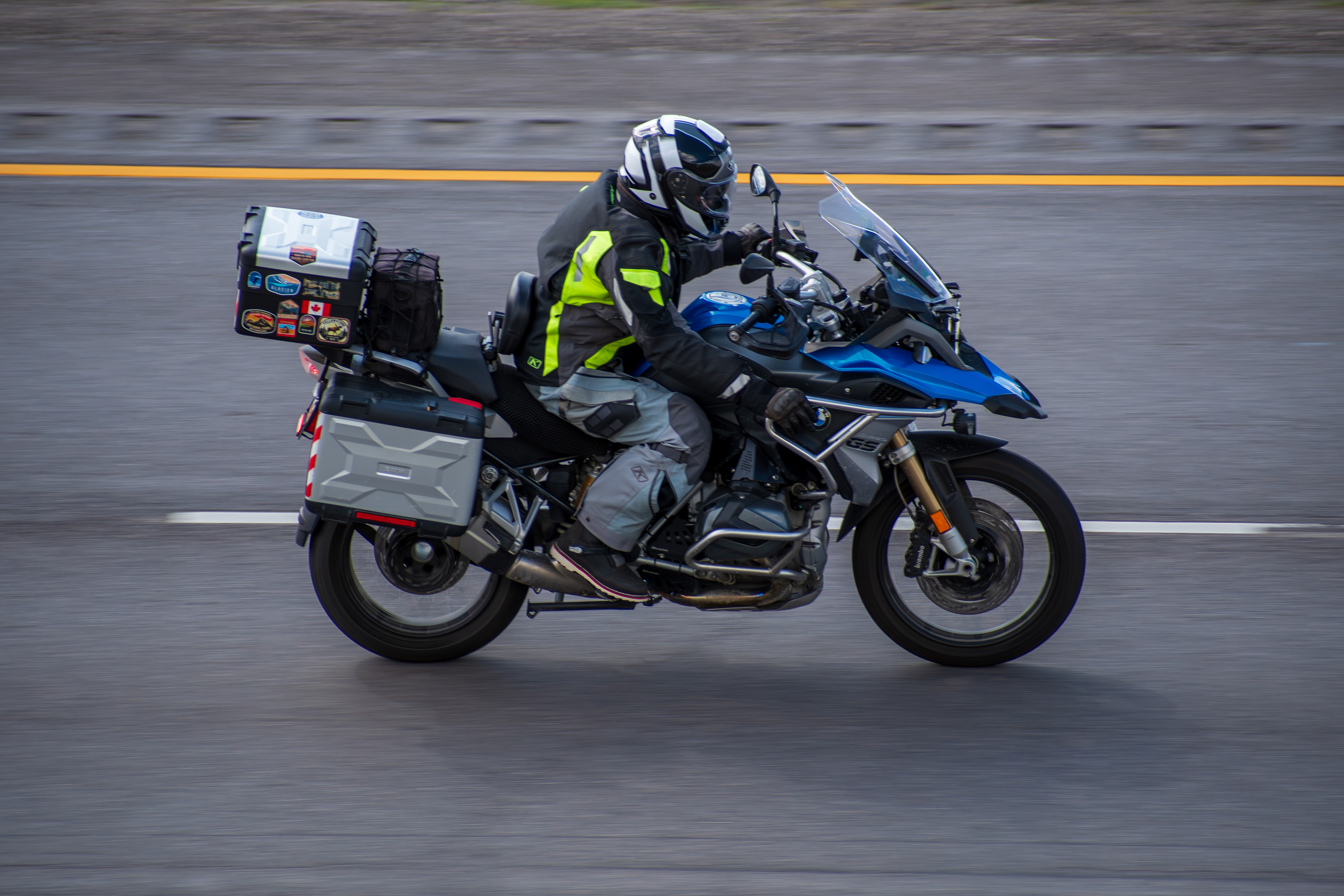 SANTAQUIN, UT - JUNE 8: A motorcyclist rides a BMW adventure touring bike northbound on Interstate 15 near Santaquin, Utah, on June 8, 2025.
