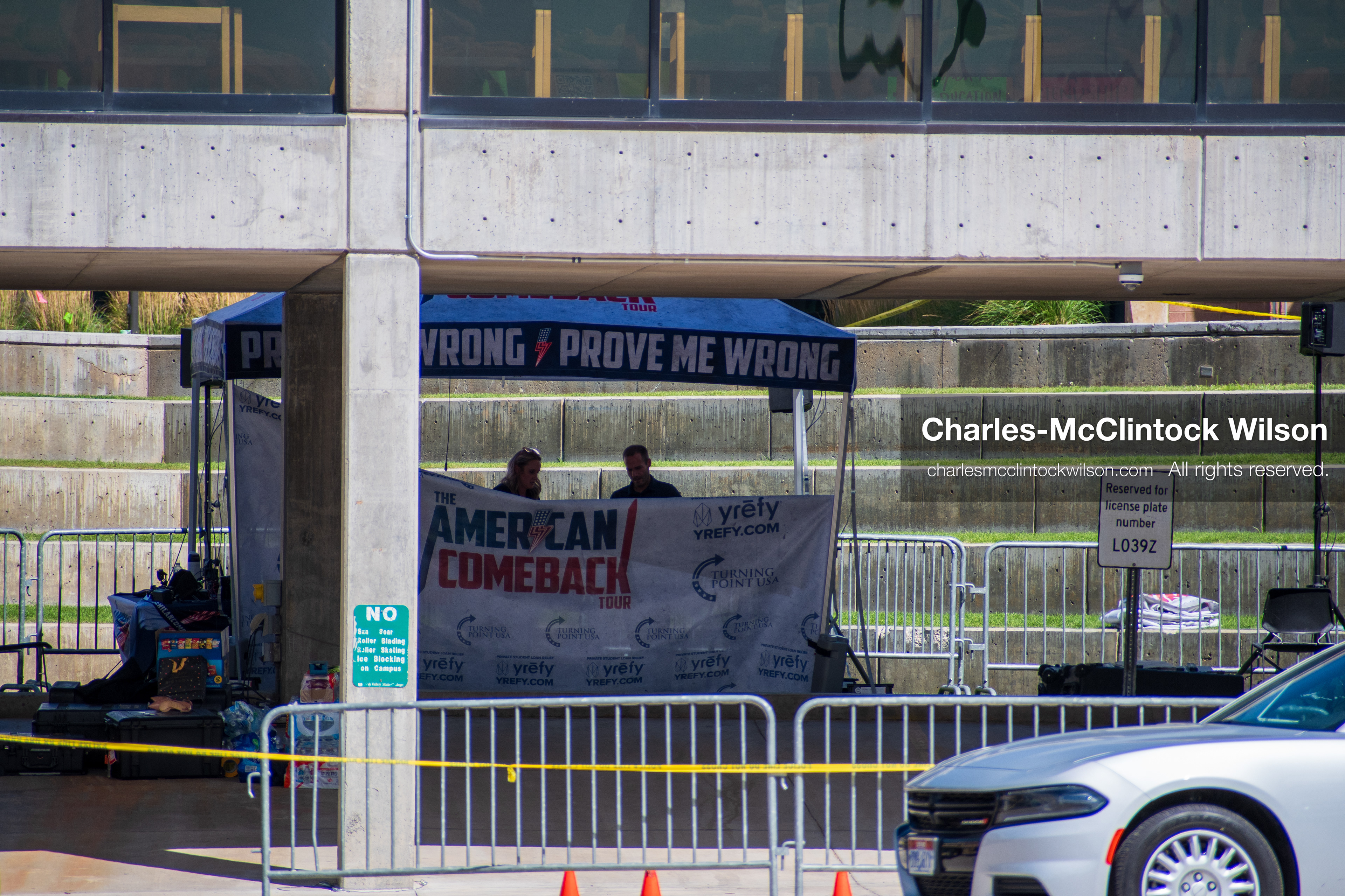 September 12, 2025, Orem, Utah, USA: Investigators and police officers secure the canopy-covered courtyard at Utah Valley University in Orem, Utah, where conservative activist CHARLIE KIRK was fatally shot during a public speaking event on September 10, 2025. KIRK, CEO of Turning Point USA, was seated beneath the canopy when a single bullet struck him in the neck.   (Credit Image: © Charles‑McClintock Wilson/ZUMA Press Wire)