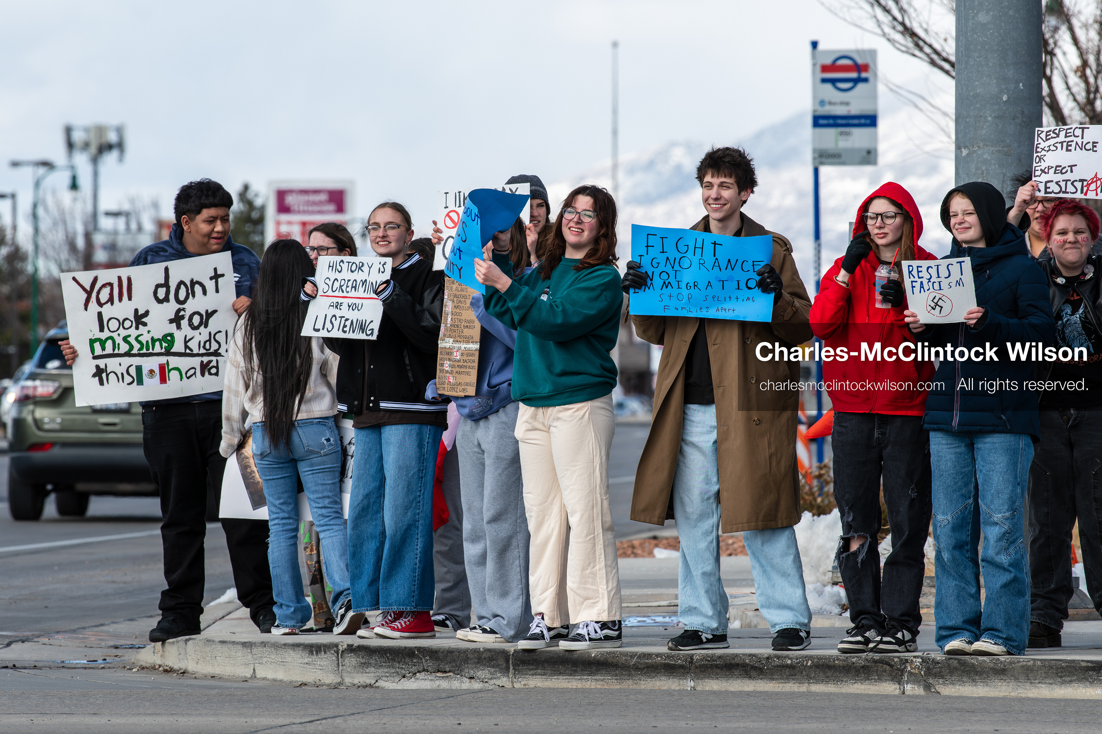 February 20, 2026, Orem, Utah, USA: High school students gather along State Street in front of Orem City Hall during a student led protest against ICE and federal immigration enforcement. Demonstrators hold signs as they stand near the roadway while traffic continues through the area. (Credit Image: © Charles McClintock Wilson/ZUMA Press Wire)