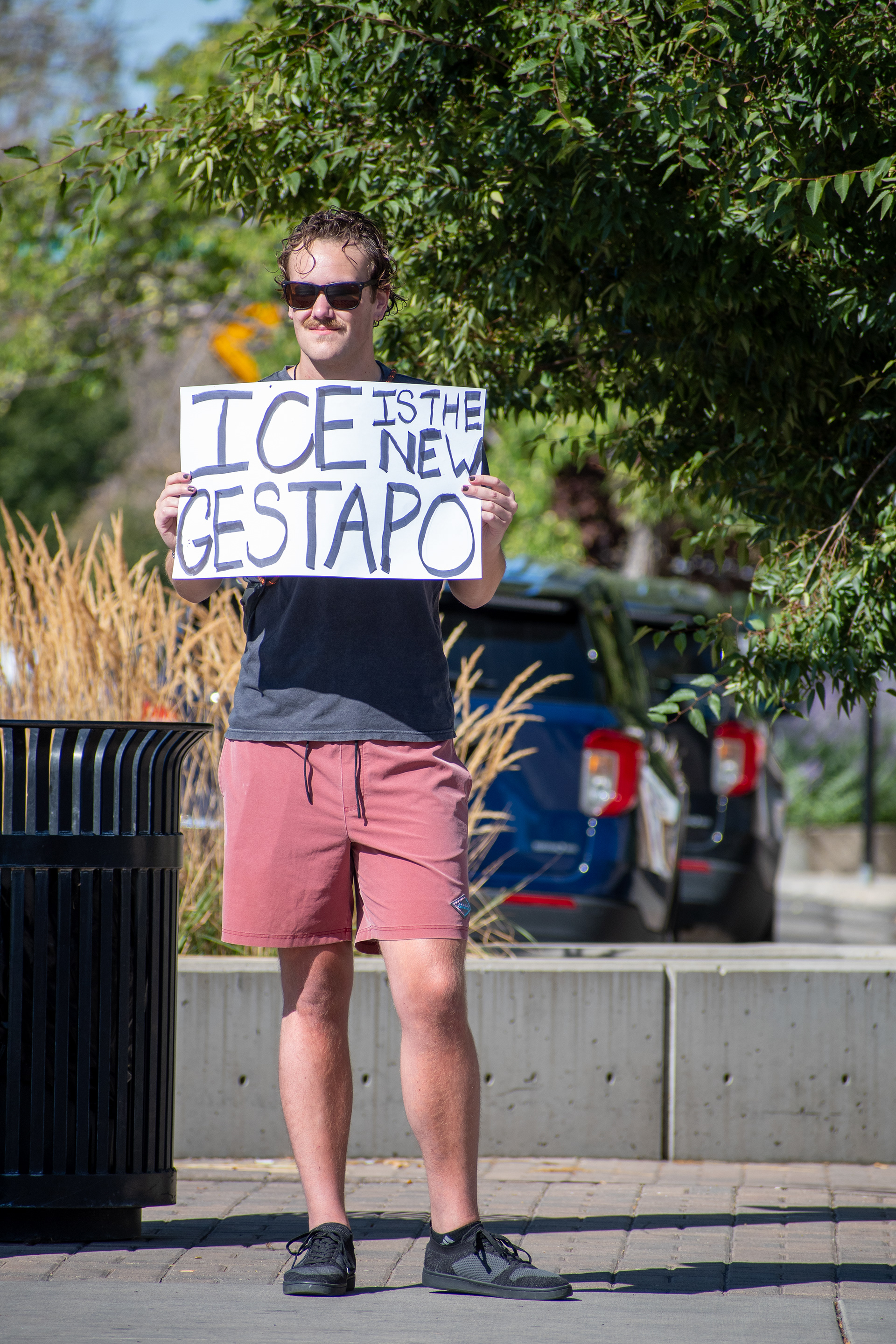 September 15, 2025 – Provo, Utah, United States: A demonstrator holds a sign reading “ICE IS THE NEW GESTAPO” outside the Utah Valley Convention Center during a protest against the Department of Homeland Security career expo. The message draws historical parallels and critiques immigration enforcement practices. Photograph by Charles‑McClintock Wilson / ZUMA Press Wire