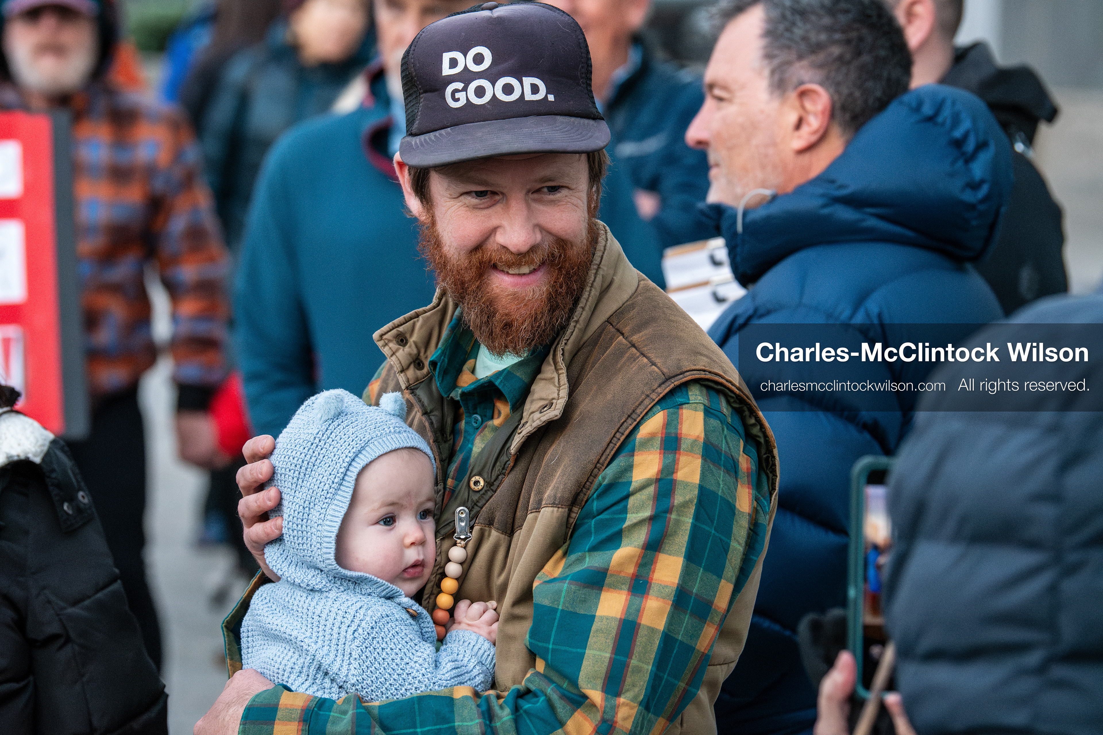January 5, 2026, Salt Lake City, Utah, USA: A demonstrator holds a baby during a protest outside the Wallace Federal Building in Salt Lake City, Utah. The rally, organized by Salt Lake Indivisible, called for congressional limits on presidential war powers following recent US military actions in Venezuela involving the government of Nicolas Maduro. Attendees signed petitions addressed to Utah US senators Mike Lee and John Curtis. (Credit Image: (c) Charles‑McClintock Wilson/ZUMA Press Wire)
