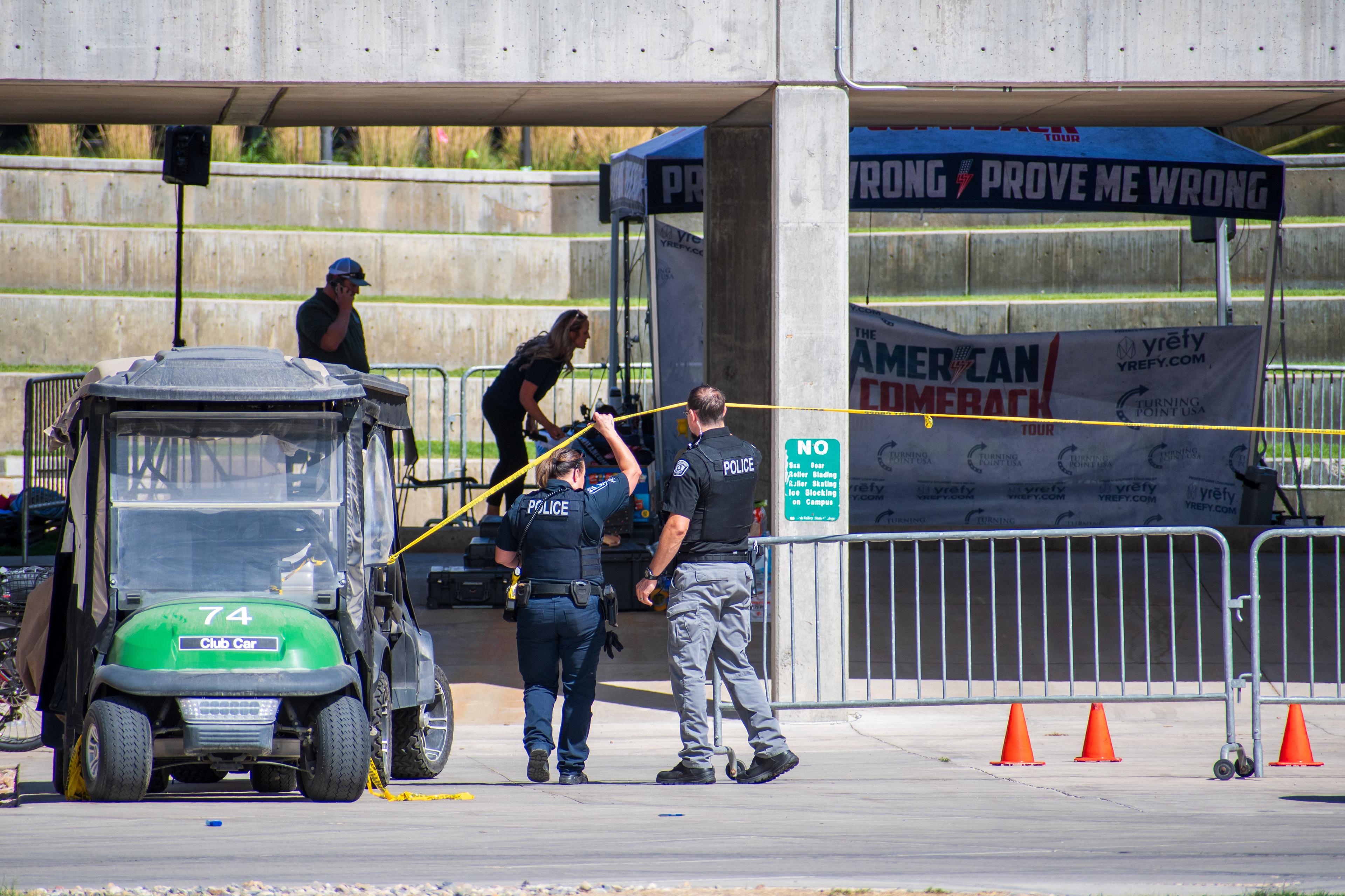 September 12, 2025 – Orem, Utah, United States: Police officers secure an area with caution tape near a tented display at Utah Valley University following the fatal shooting of conservative activist Charlie Kirk, who was assassinated during a public event on campus two days earlier. Photograph by Charles‑McClintock Wilson / ZUMA Press Wire