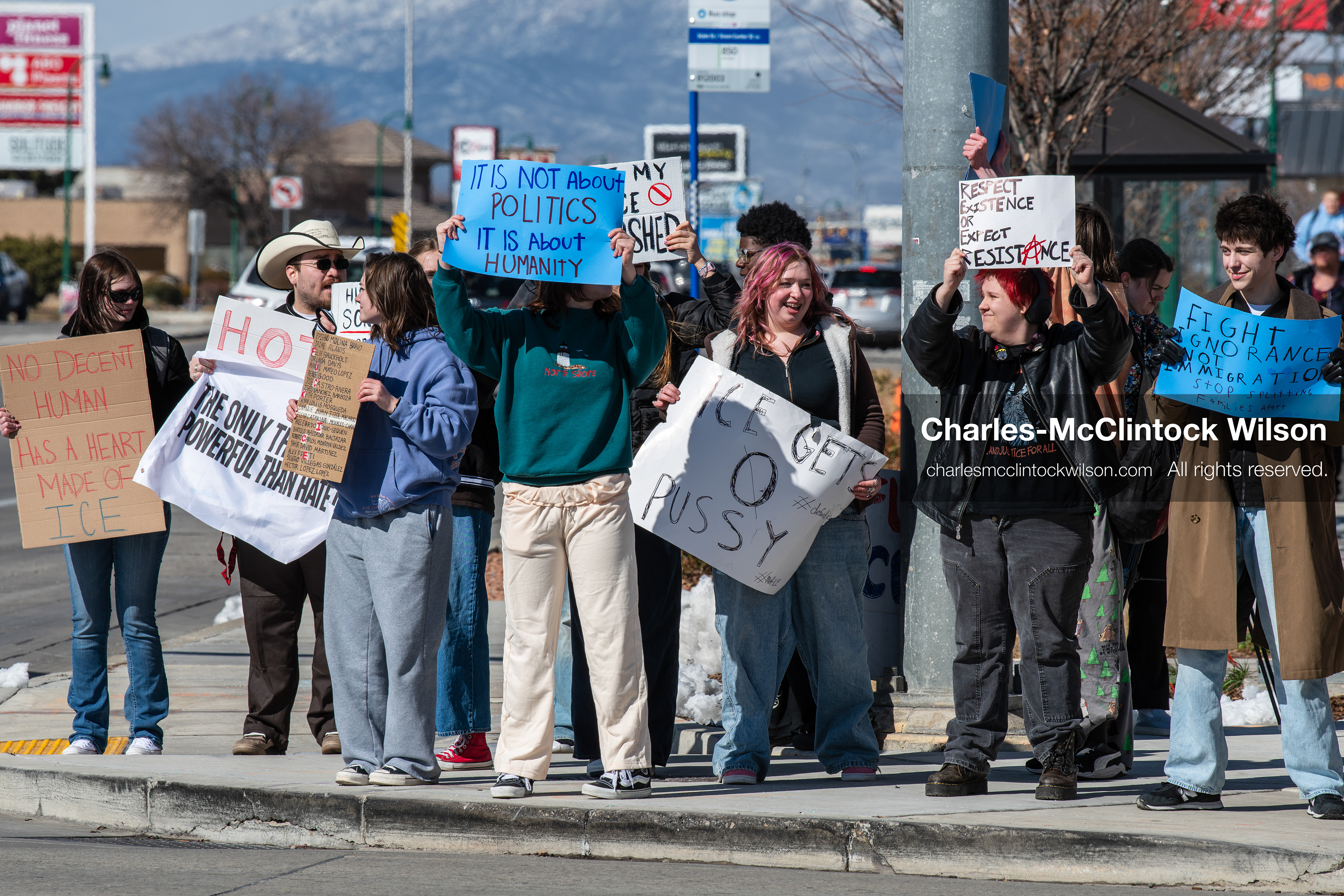 February 20, 2026, Orem, Utah, USA: High school students gather along State Street in front of Orem City Hall during a student led protest against ICE and federal immigration enforcement. Demonstrators hold signs as they stand near the roadway while traffic continues through the area. (Credit Image: © Charles McClintock Wilson/ZUMA Press Wire)