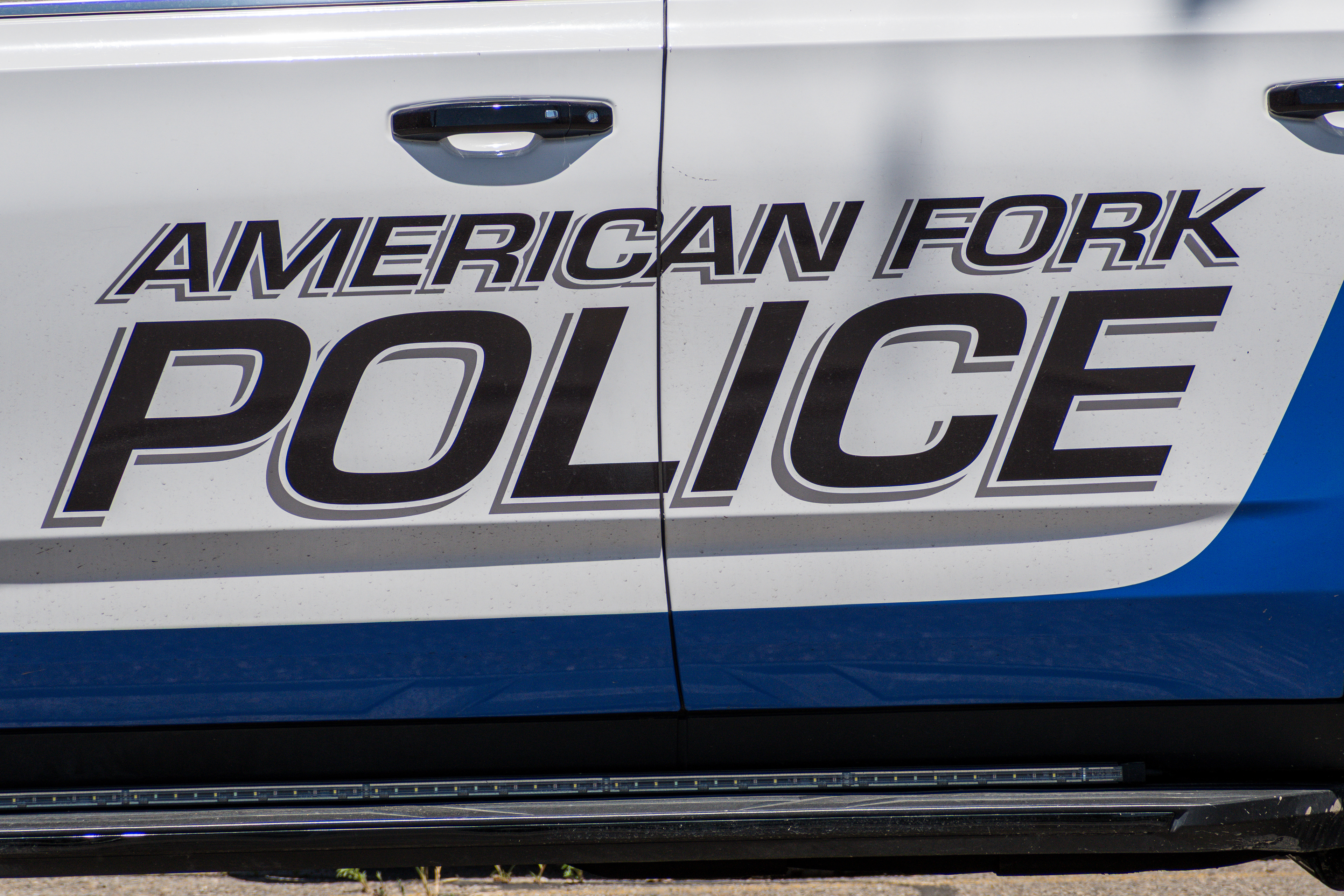 American Fork, Utah – June 2, 2025. Police vehicles are parked outside the American Fork Police Department headquarters.