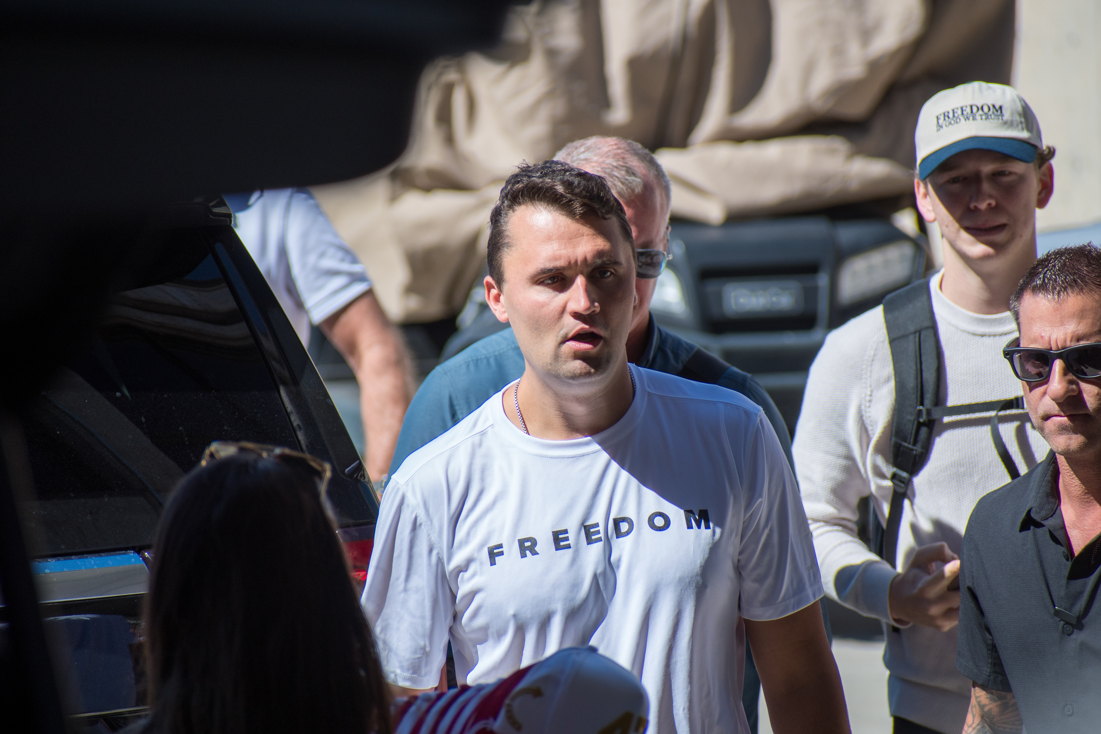 OREM, UTAH – SEPTEMBER 10, 2025: Charlie Kirk arrives at Utah Valley University for a scheduled public event. Wearing a shirt emblazoned with the word “FREEDOM,” Kirk walks among supporters and staff in a moment of visible anticipation. The image marks the beginning of his final public appearance, capturing the atmosphere of civic energy and symbolic presence that defined the day. © Charles-McClintock Wilson / ZUMA Press