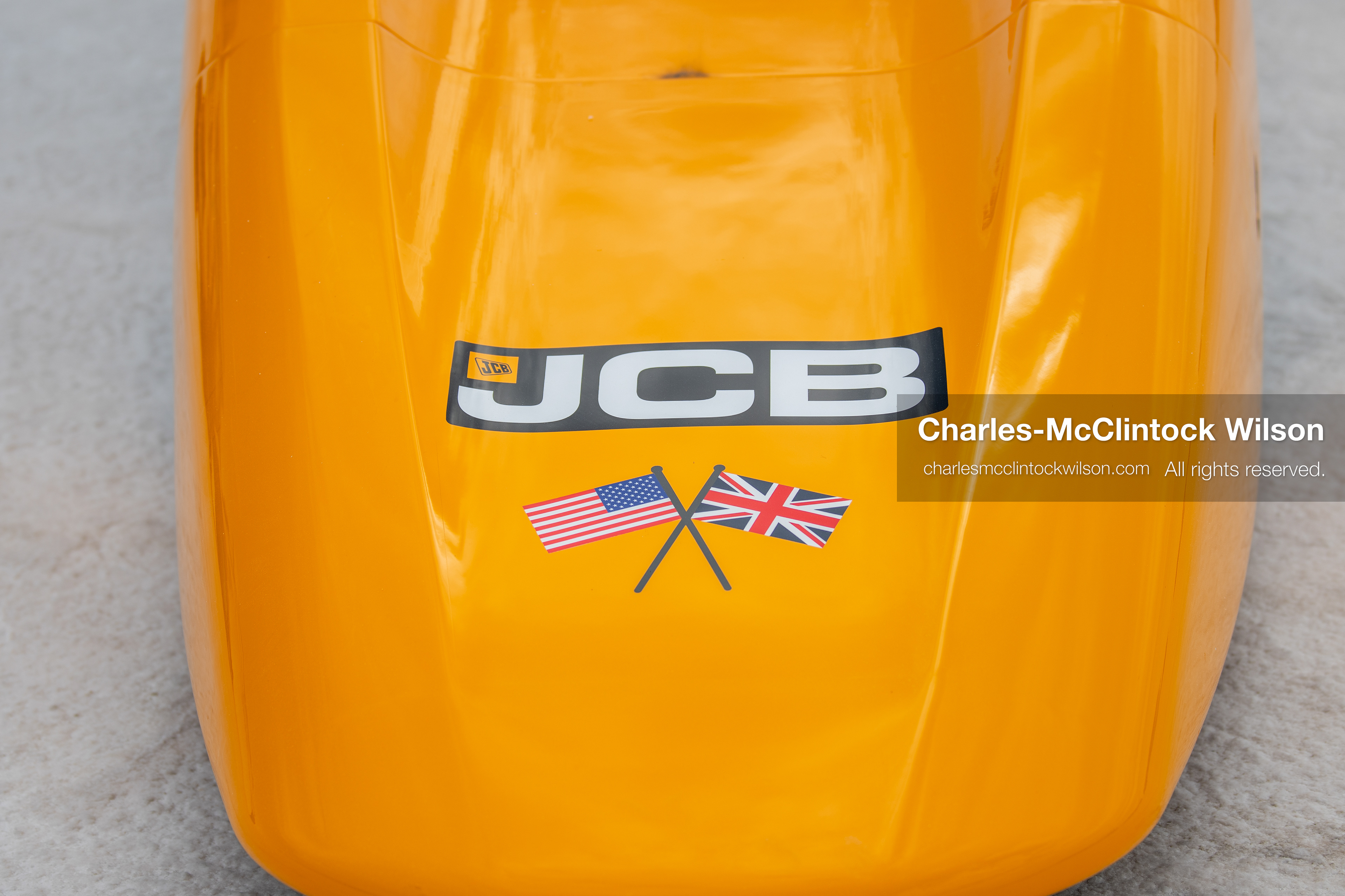 A detailed shot shows a JCB logo alongside crossed American and British flag graphics on the bodywork of the hydrogen-powered "JCB Hydromax" streamliner on the Bonneville Salt Flats on Tuesday. Driven by British pilot Andy Green, the vehicle achieved a record speed of 406.320 mph during official speed trials. (Photo by Charles-McClintock Wilson/Sipa USA)