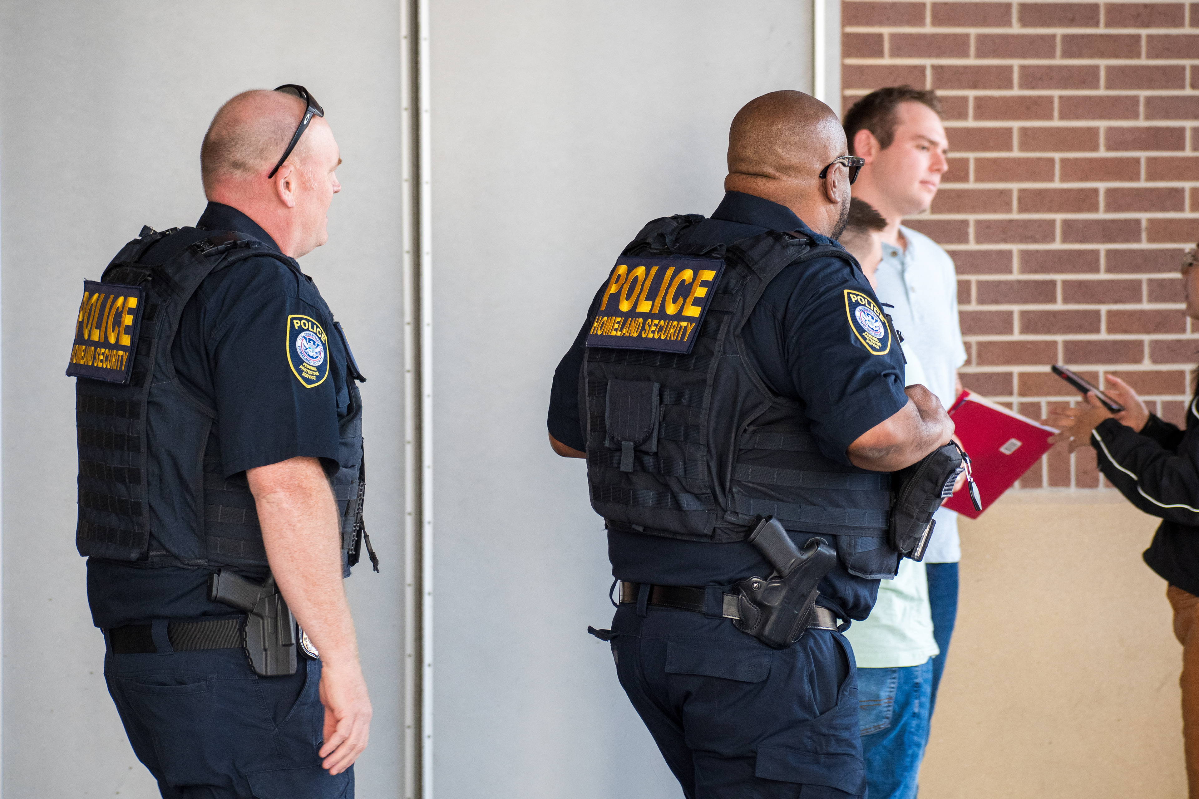 September 15, 2025 – Provo, Utah, United States: Two Homeland Security police officers walk through a parking lot near the Utah Valley Convention Center during a Department of Homeland Security career expo focused on recruiting law enforcement and security personnel. Photograph by Charles‑McClintock Wilson / ZUMA Press Wire