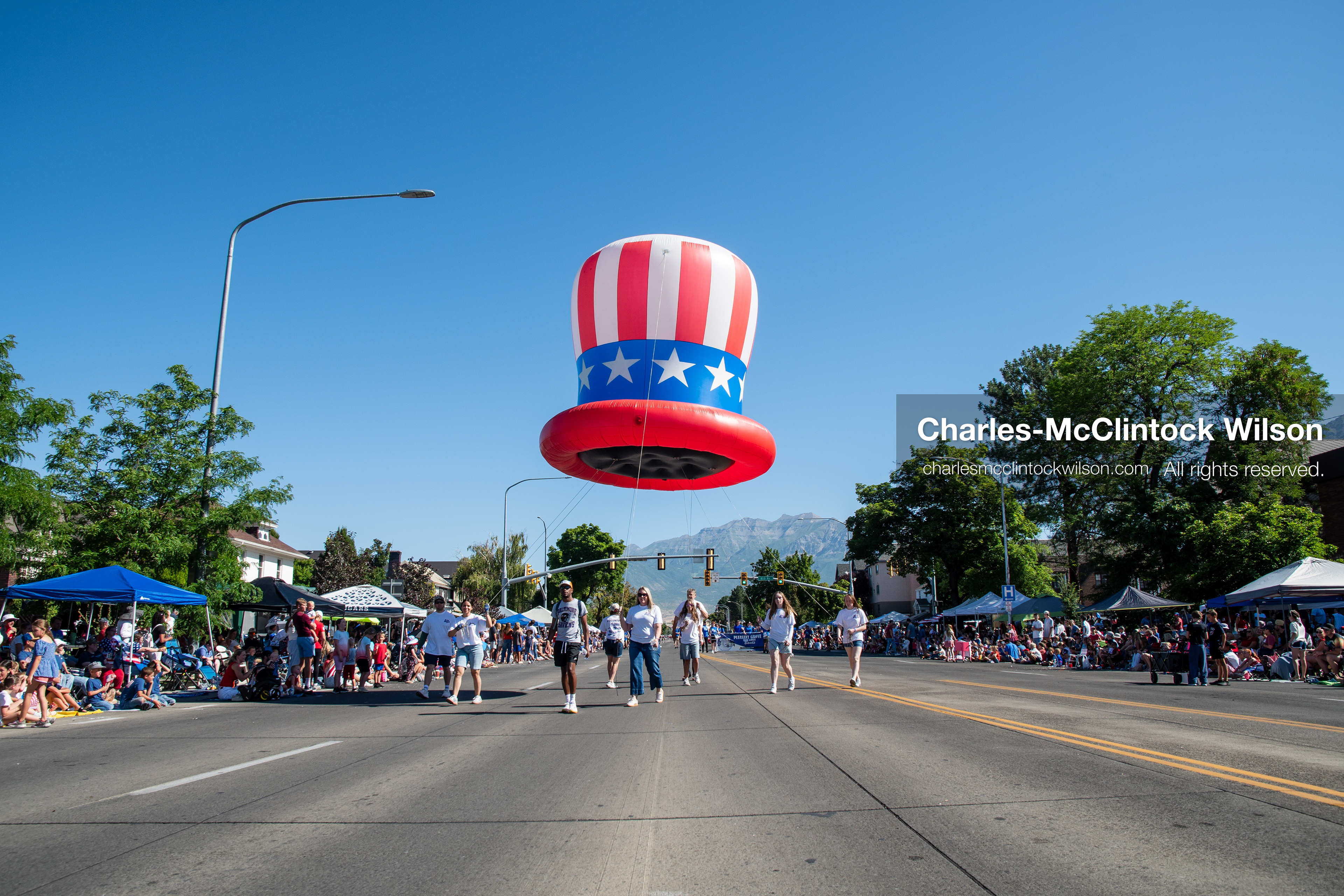 July 4, 2026, Provo, Utah, USA: Handlers guide a giant Uncle Sam style patriotic top hat helium balloon down the street during America's Freedom Festival Grand Parade in Provo, Utah, Saturday, July 4, 2026. The annual Independence Day event features expanded programming to honor the 250th anniversary of United States independence. (Credit Image: © Charles-McClintock Wilson/ZUMA Press Wire)