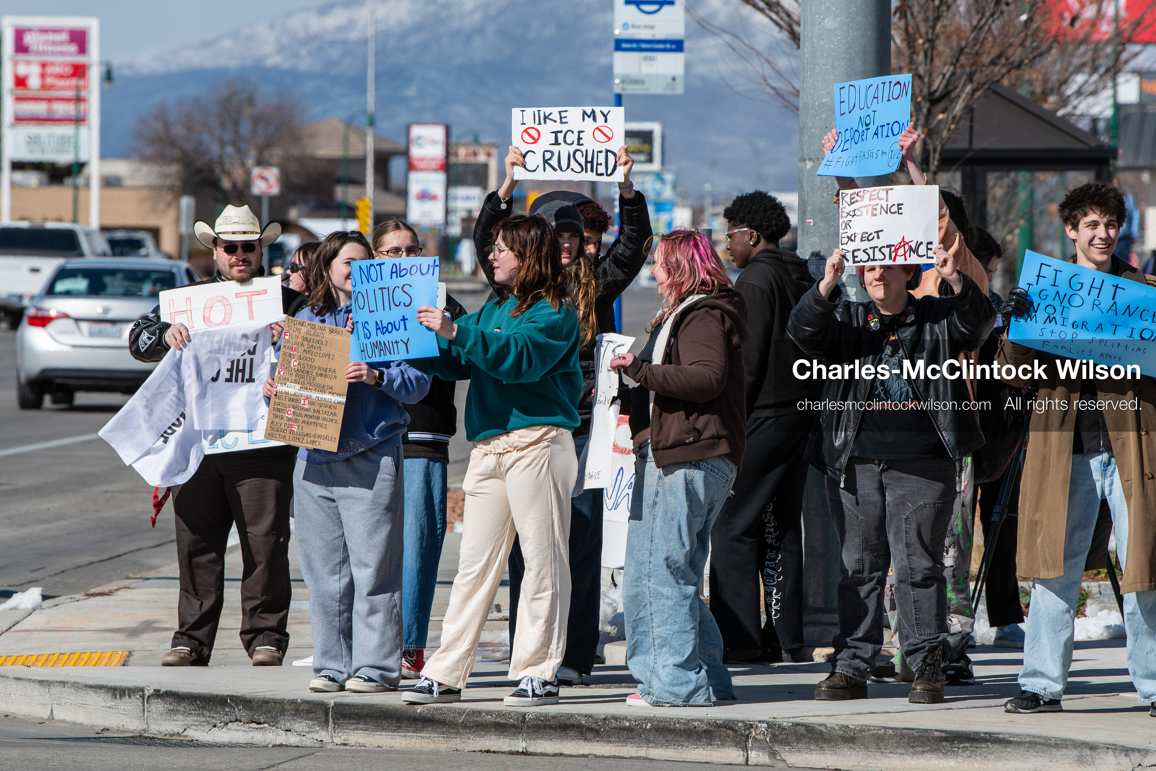 February 20, 2026, Orem, Utah, USA: High school students gather along State Street in front of Orem City Hall during a student led protest against ICE and federal immigration enforcement. Demonstrators hold signs as they stand near the roadway while traffic continues through the area. (Credit Image: © Charles McClintock Wilson/ZUMA Press Wire)