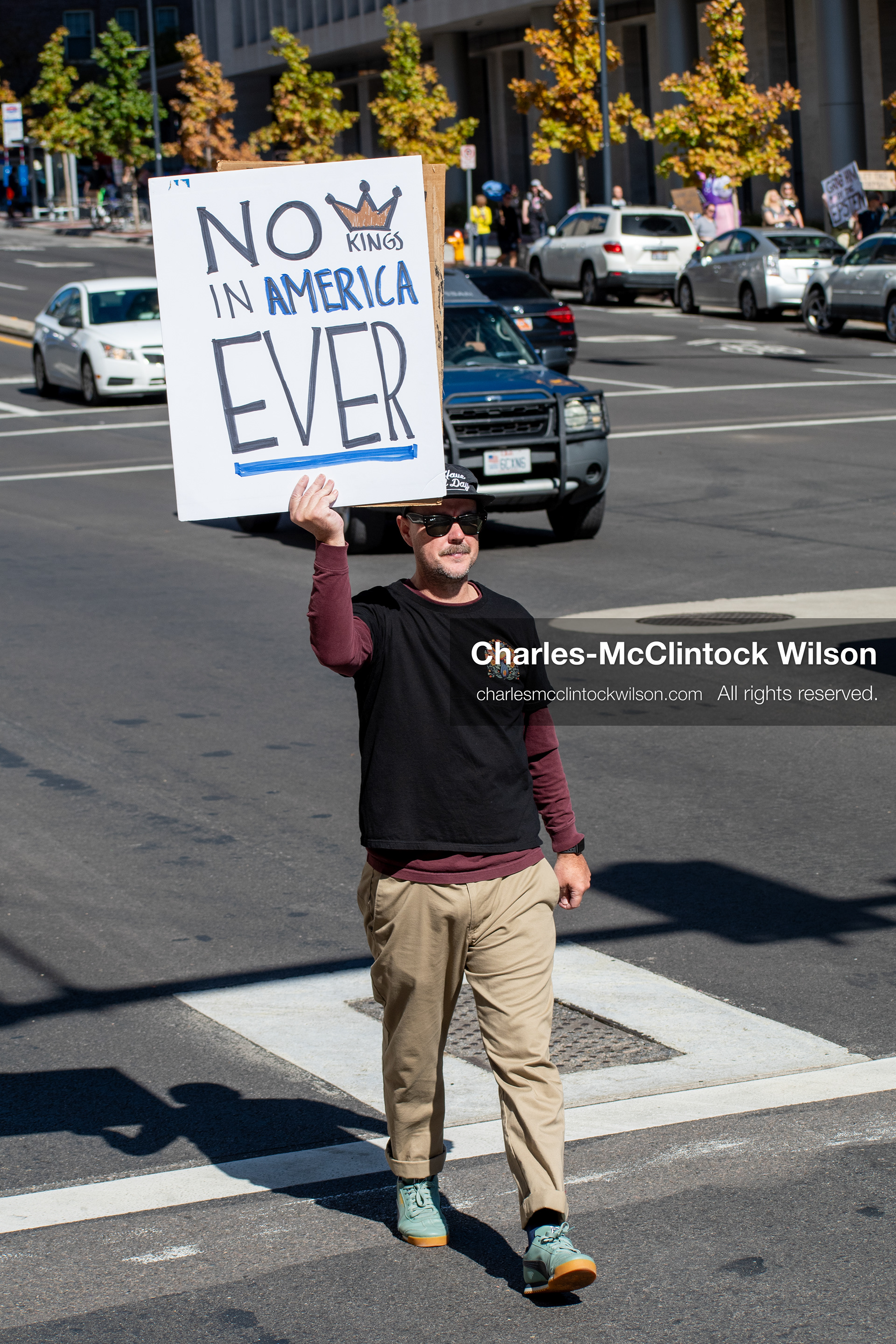 October 18, 2025, Salt Lake City, Utah, USA: Demonstrators march along South State Street during a "No Kings" protest in Salt Lake City, Utah. The protest was part of a nationwide mobilization.