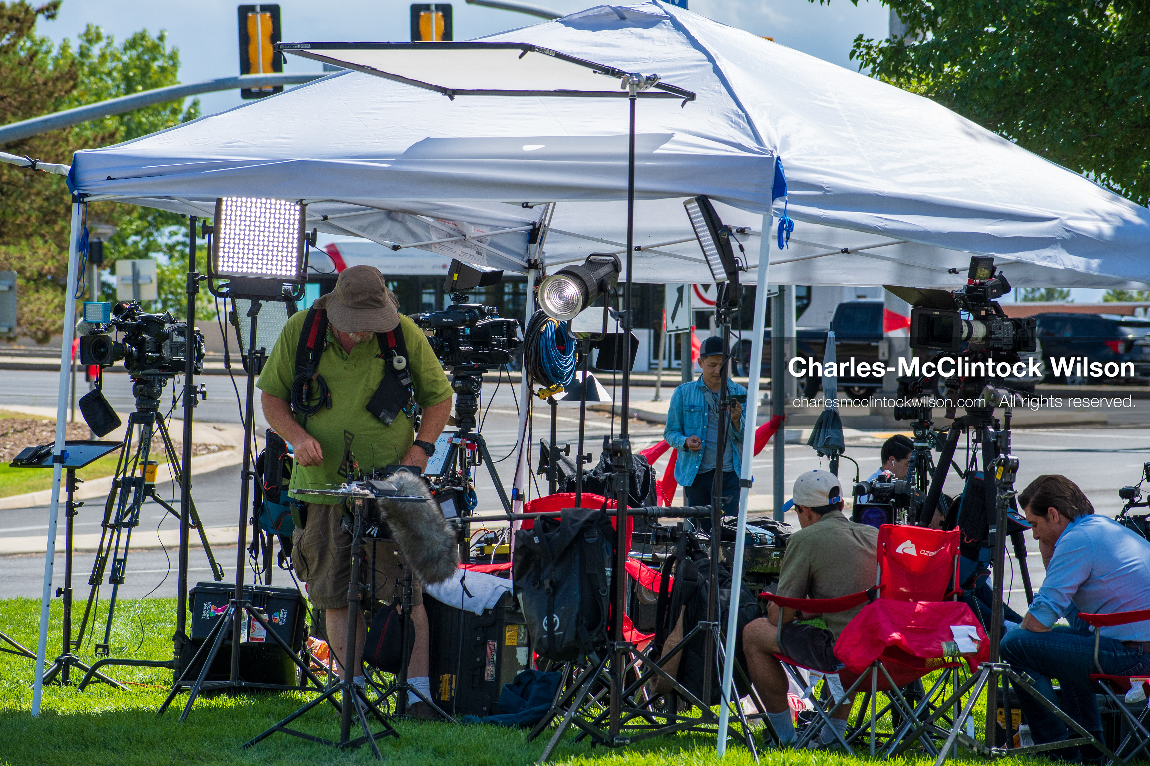 September 12, 2025, Orem, Utah, USA: Members of the press operate cameras and audio equipment beneath a canopy near the site of the fatal shooting of conservative activist Charlie Kirk at Utah Valley University. The media setup includes tripods, boom microphones, and LED lights as crews prepare for live coverage following the September 10 incident.   (Credit Image: © Charles‑McClintock Wilson/ZUMA Press Wire)