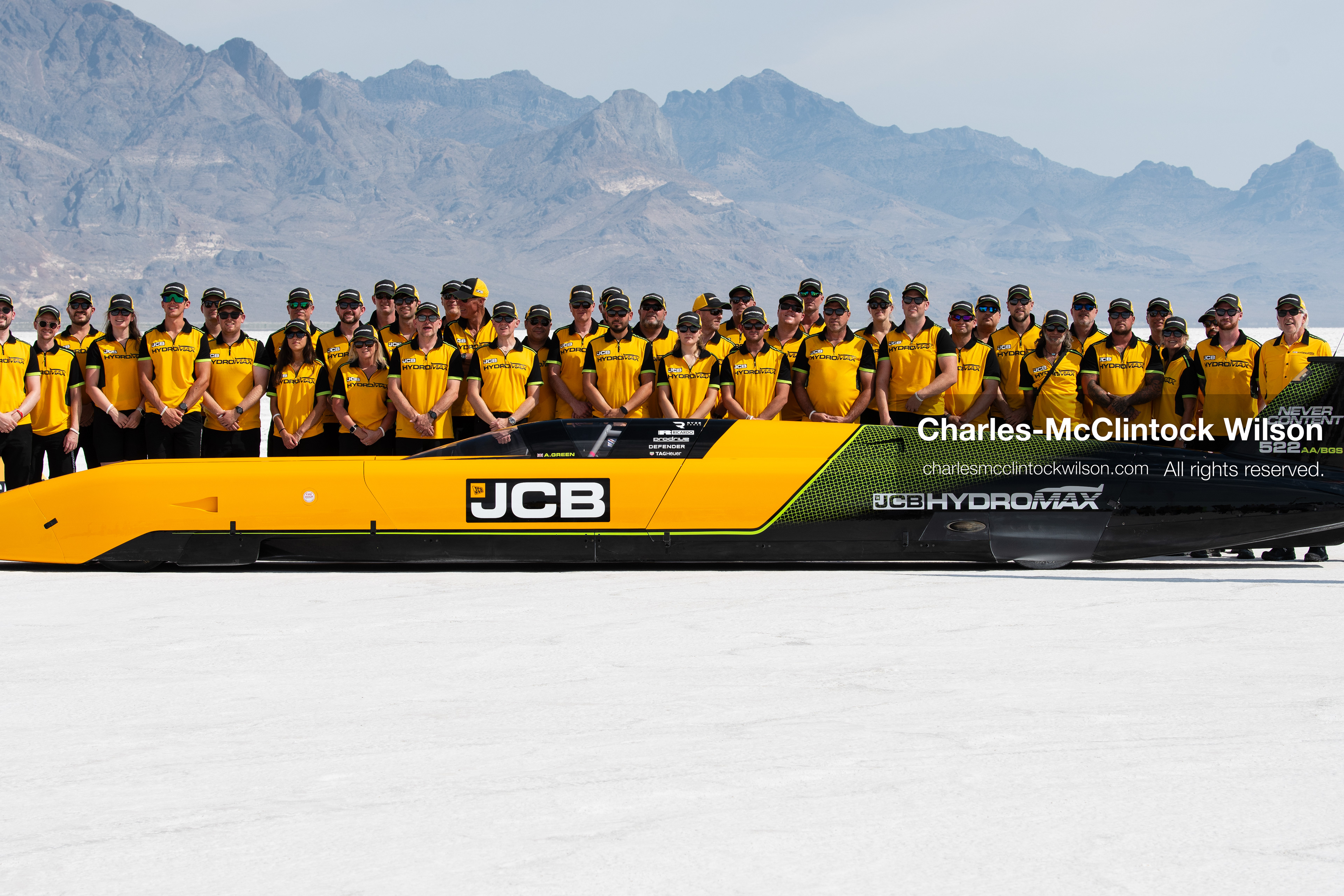 August 11, 2026, Wendover, Utah, USA: British pilot Andy Green and the JCB engineering team pose for a group photo behind the ''JCB Hydromax'' hydrogen-powered streamliner on the Bonneville Salt Flats on Tuesday. The team celebrated setting a new land speed record for a hydrogen vehicle, reaching a top speed of 406.320 mph. (Credit Image: © Charles McClintock Wilson/ZUMA Press Wire)