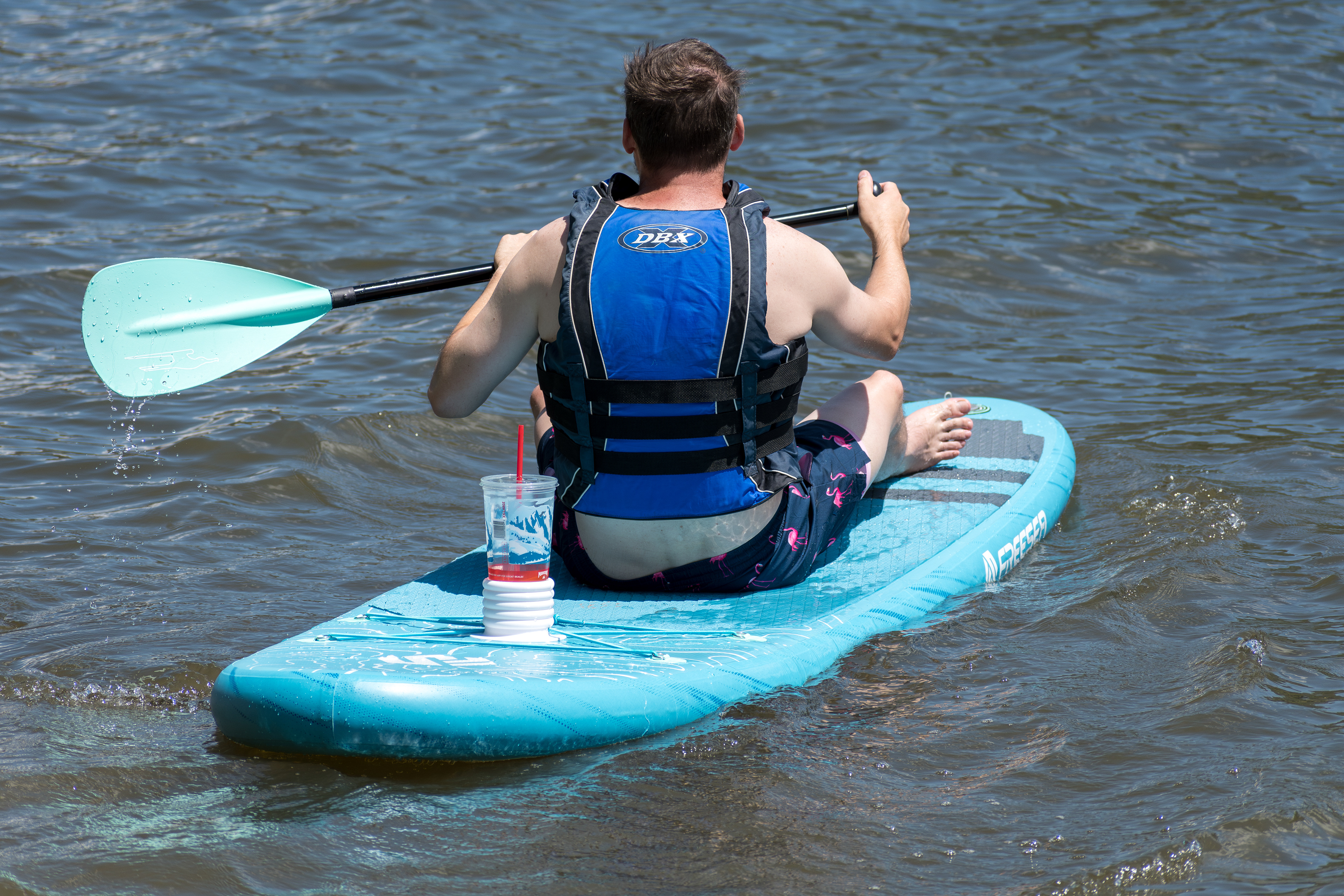 Summit County, Utah – July 20, 2025: A man paddleboards across the water at Smith and Morehouse Reservoir. 
