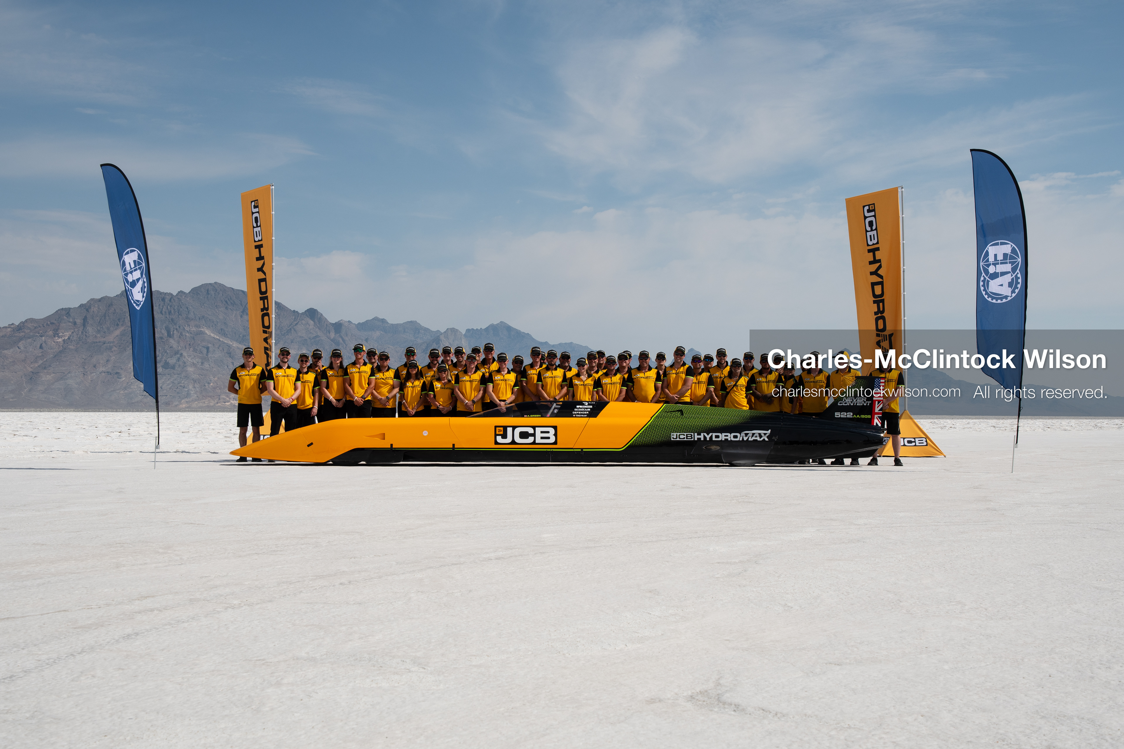 August 11, 2026, Wendover, Utah, USA: British pilot Andy Green and the JCB engineering team pose for a group photo behind the ''JCB Hydromax'' hydrogen-powered streamliner on the Bonneville Salt Flats on Tuesday. The team celebrated setting a new land speed record for a hydrogen vehicle, reaching a top speed of 406.320 mph. (Credit Image: © Charles McClintock Wilson/ZUMA Press Wire)