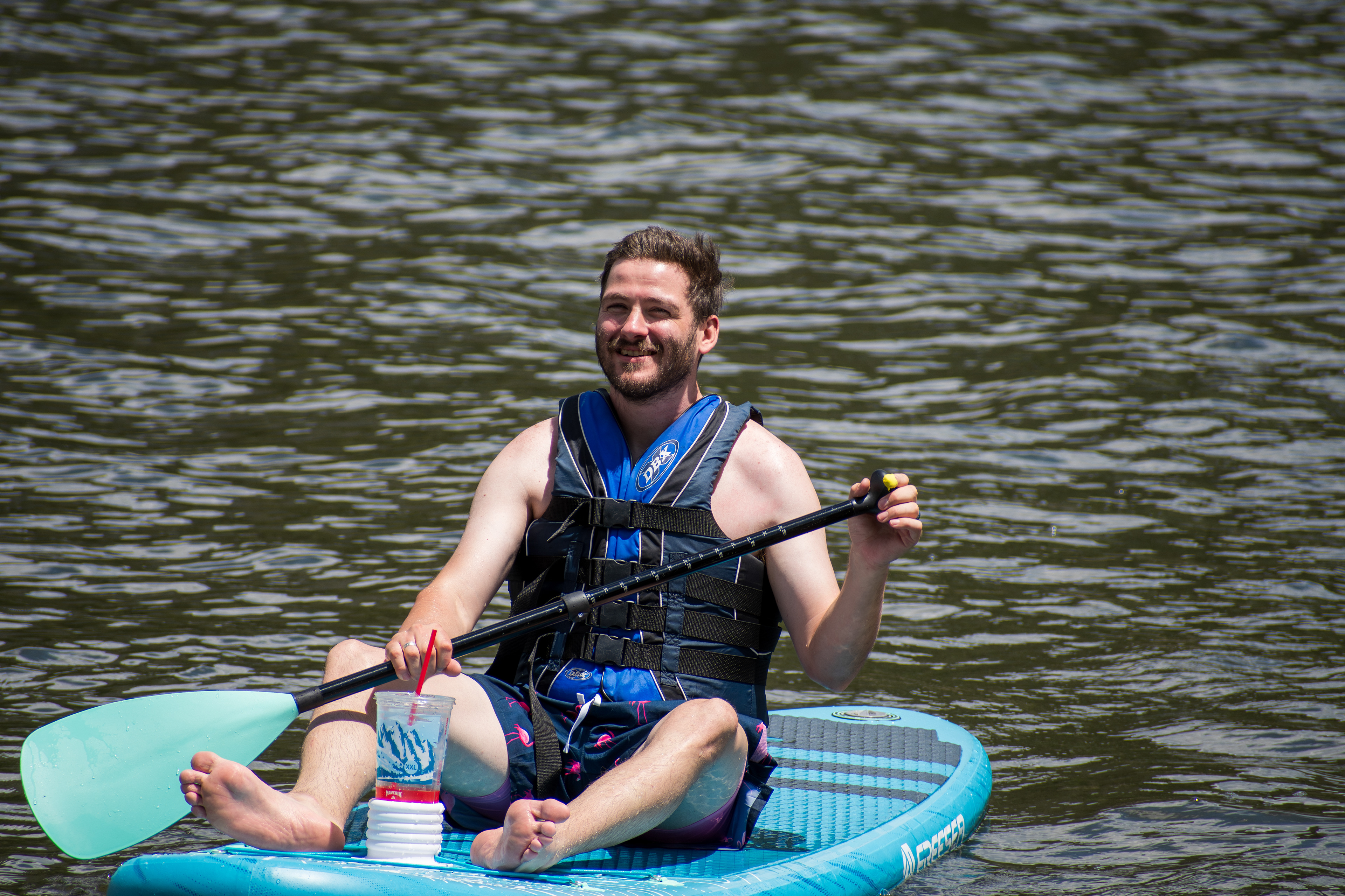 Summit County, Utah – July 20, 2025: A man paddleboards across the water at Smith and Morehouse Reservoir. 