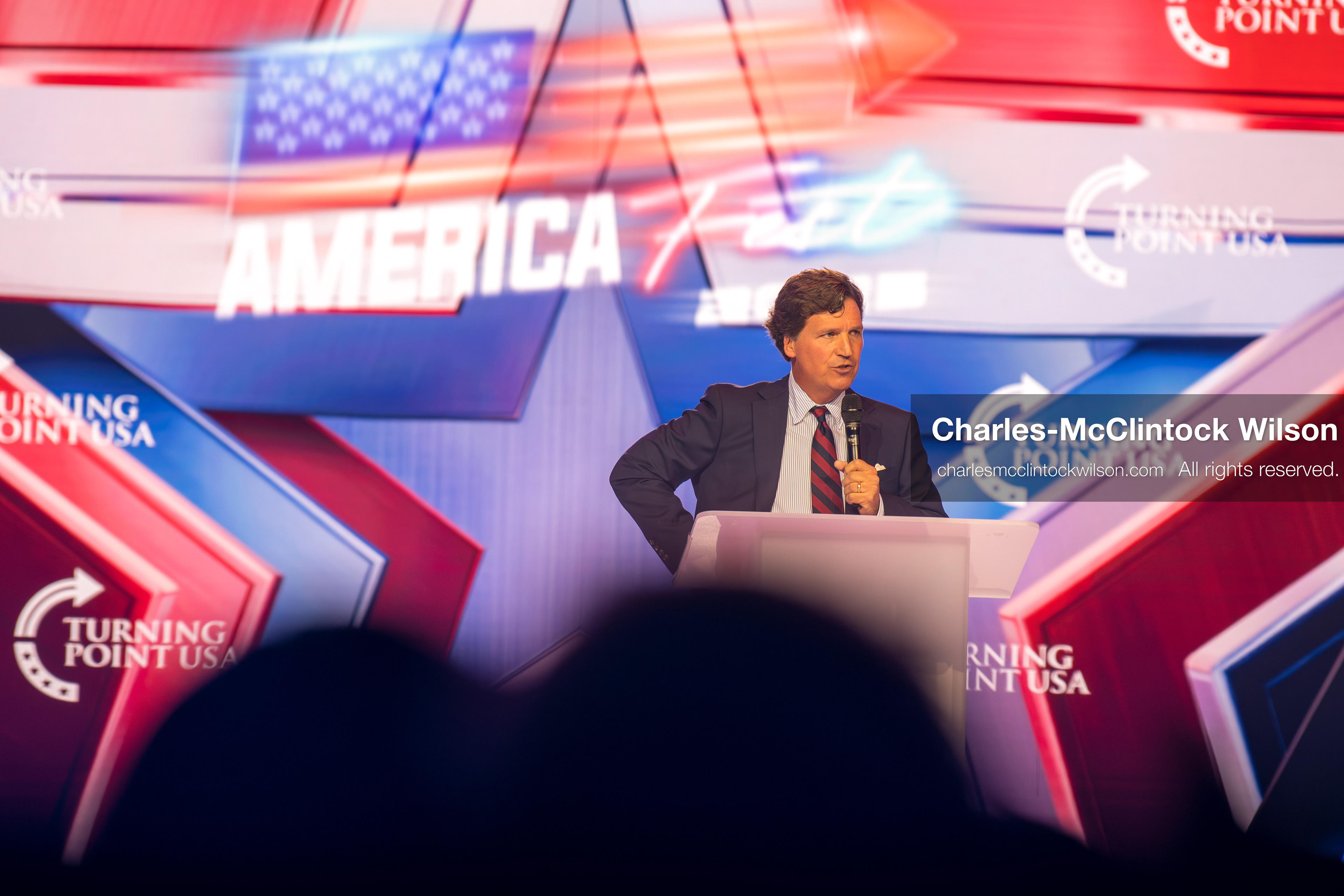 December 18, 2025, Phoenix, Arizona, USA: Tucker Carlson speaks on Day One of Turning Point USA’s AmericaFest 2025 at the Phoenix Convention Center in Phoenix, Arizona.   (Credit Image: © Charles‑McClintock Wilson/ZUMA Press Wire)