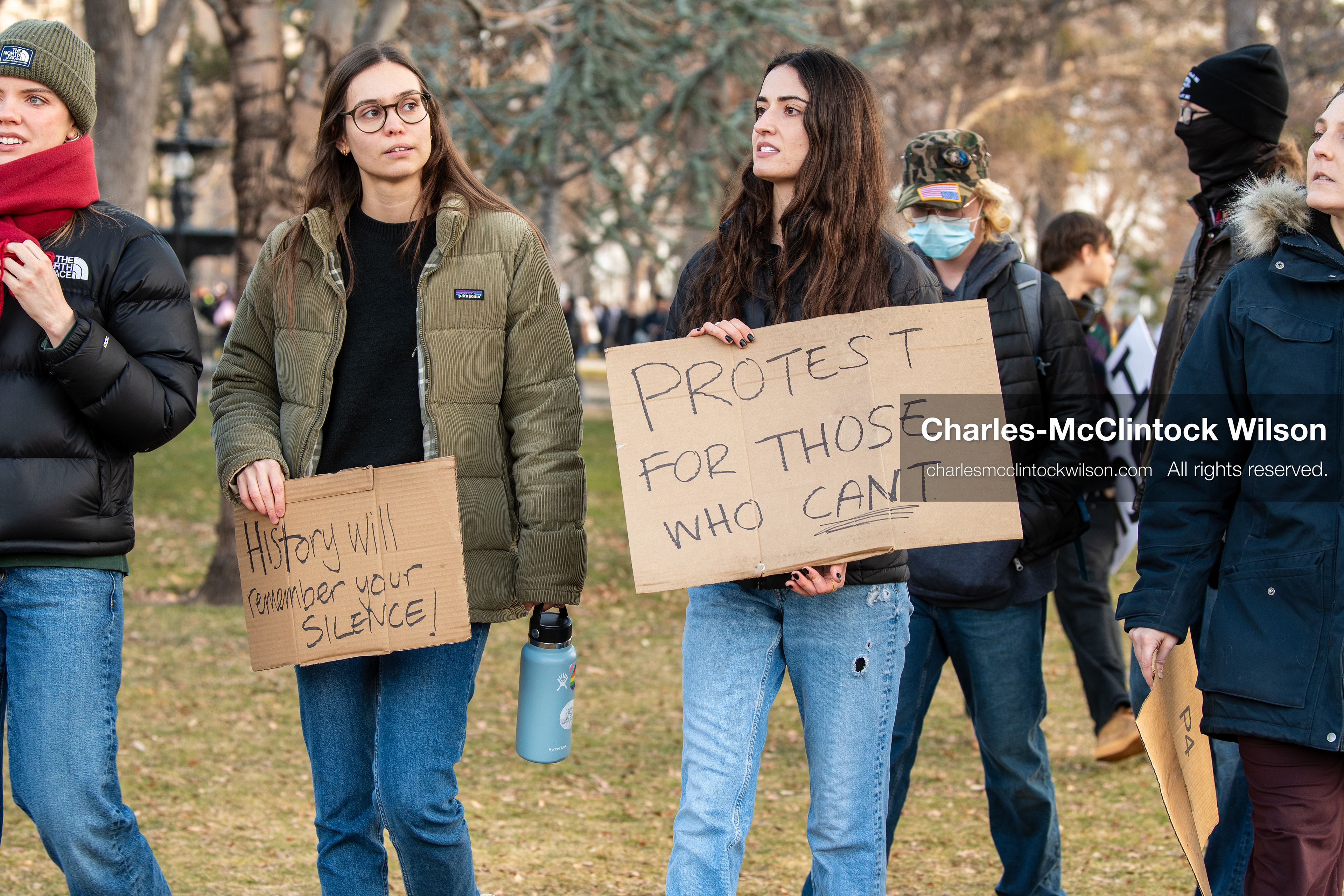 January 30, 2026, Salt Lake City, Utah, USA: Two demonstrators hold signs at Washington Square Park during an anti‑ICE protest in Salt Lake City, part of a nationwide response to immigration enforcement policies. (Credit Image: © Charles‑McClintock Wilson/ZUMA Press Wire)