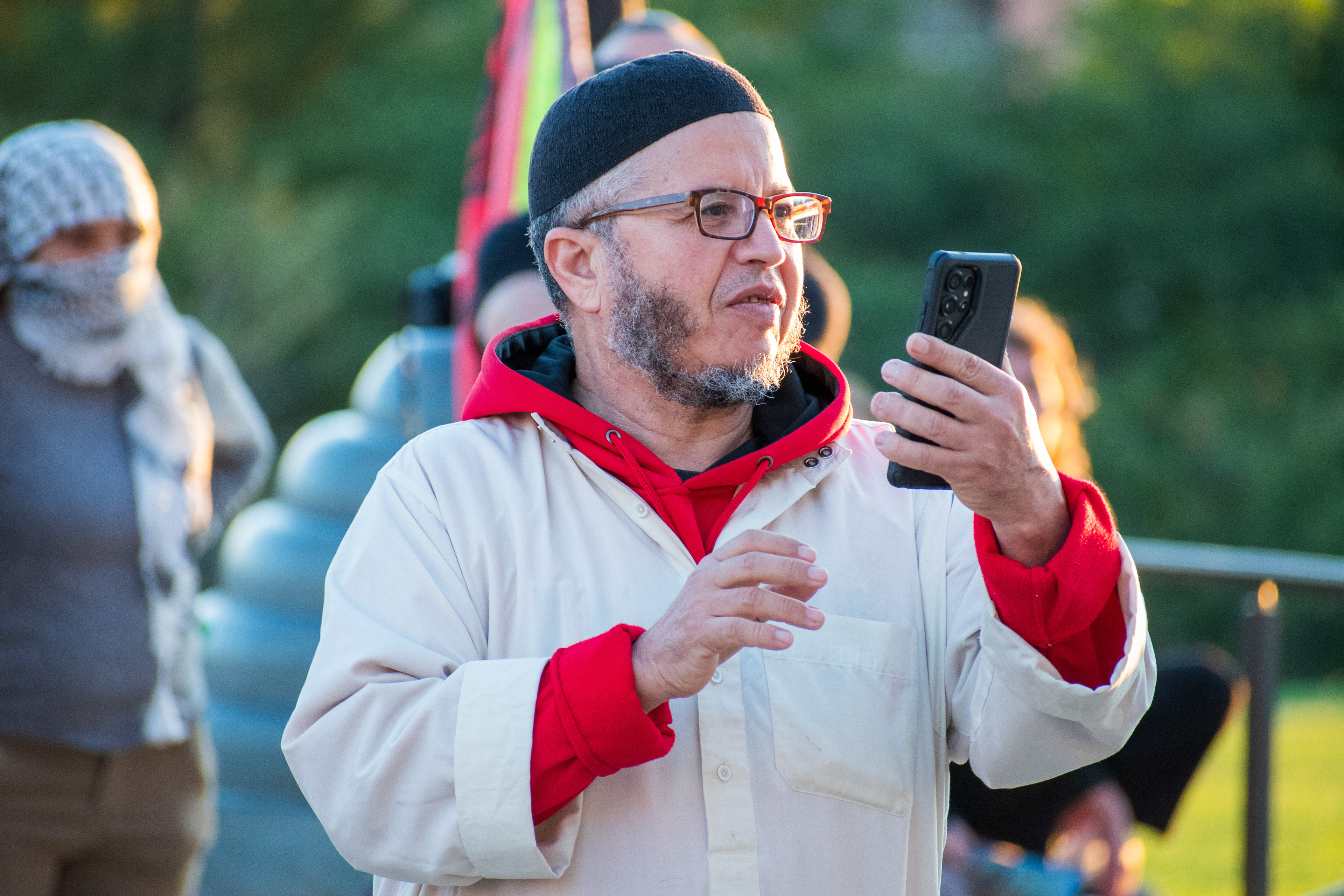 October 10, 2025, Salt Lake City, Utah, USA: A demonstrator records with a smartphone during the Free Palestine Rally organized in front of the Utah State Capitol. (Credit Image: © Charles-McClintock Wilson/ZUMA Press Wire)