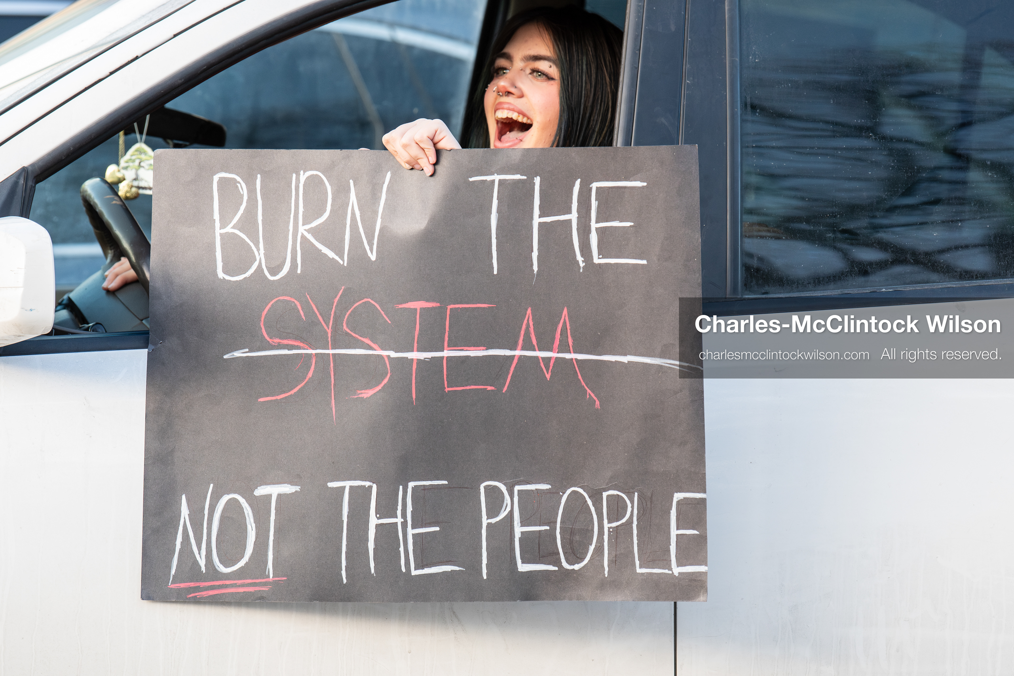 January 30, 2026, Salt Lake City, Utah, USA: A demonstrator displays a protest sign from a vehicle during an anti‑ICE protest in Salt Lake City, part of a nationwide response to immigration enforcement policies. (Credit Image: © Charles‑McClintock Wilson/ZUMA Press Wire)