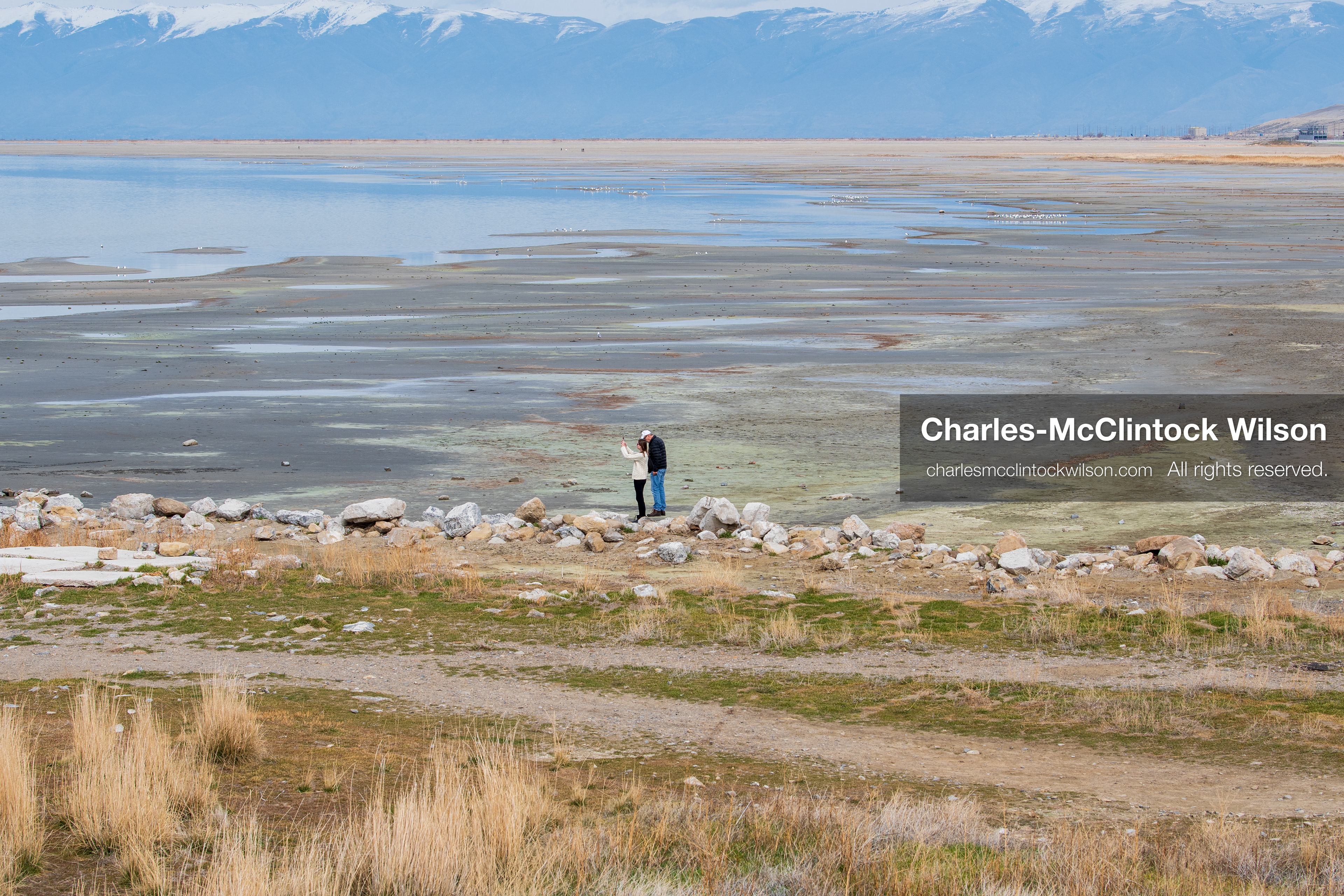 March 1, 2026, Great Salt Lake, Utah, USA: People walk along a path near the shoreline of the Great Salt Lake as the region continues to experience historically low water levels. Reports from state officials and the Great Salt Lake Strike Team state that the lake remains in a serious adverse‑effects range, with elevations among the lowest recorded in more than one hundred years. The lake has drawn increased public attention as lawmakers consider large‑scale water projects and long‑term plans to address declining conditions. (Credit Image: © Charles‑McClintock Wilson/ZUMA Press Wire)