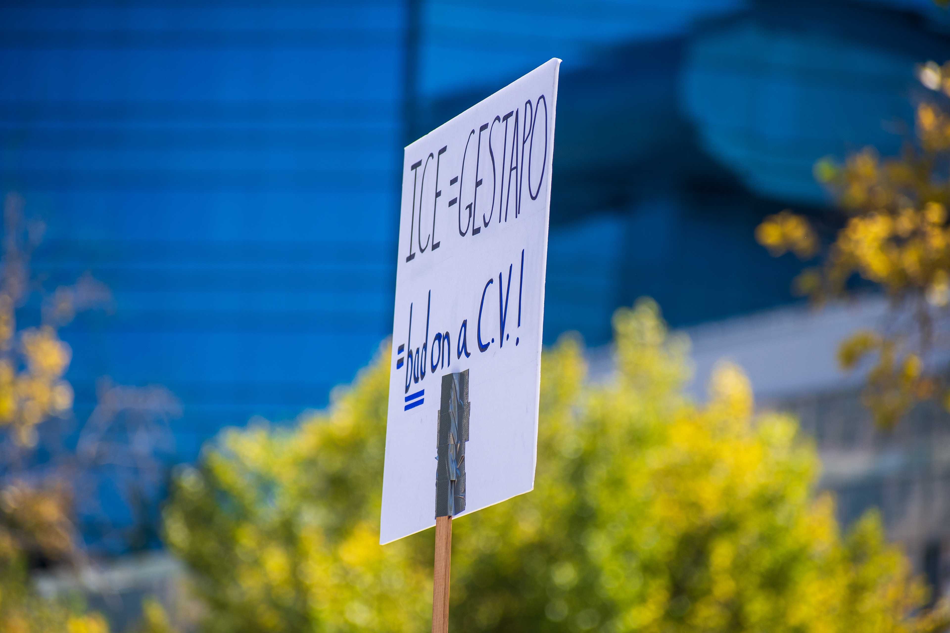 September 15, 2025 – Provo, Utah, United States: A protest sign reading “ICE = GESTAPO #Not on a C.V.!!” is held outside the Utah Valley Convention Center during a demonstration against the Department of Homeland Security career expo. The message draws historical parallels and critiques the inclusion of immigration enforcement experience on professional résumés. Photograph by Charles‑McClintock Wilson / ZUMA Press Wire