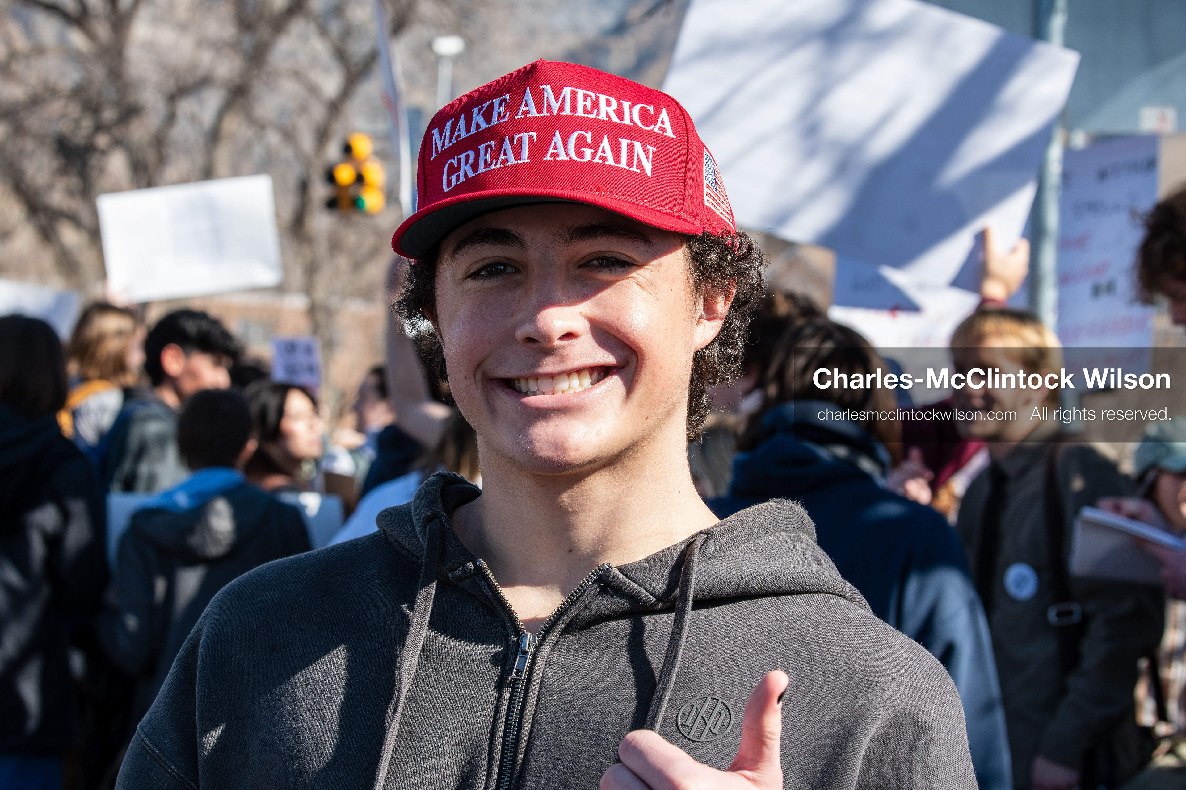 February 5, 2026, Provo, Utah, USA: A young person wearing a red Make America Great Again hat stands among demonstrators near Brigham Young University in Provo during a gathering opposing the presence of US Customs and Border Protection recruiters at a career fair held on the BYU campus. (Credit Image: © Charles McClintock Wilson/ZUMA Press Wire) 