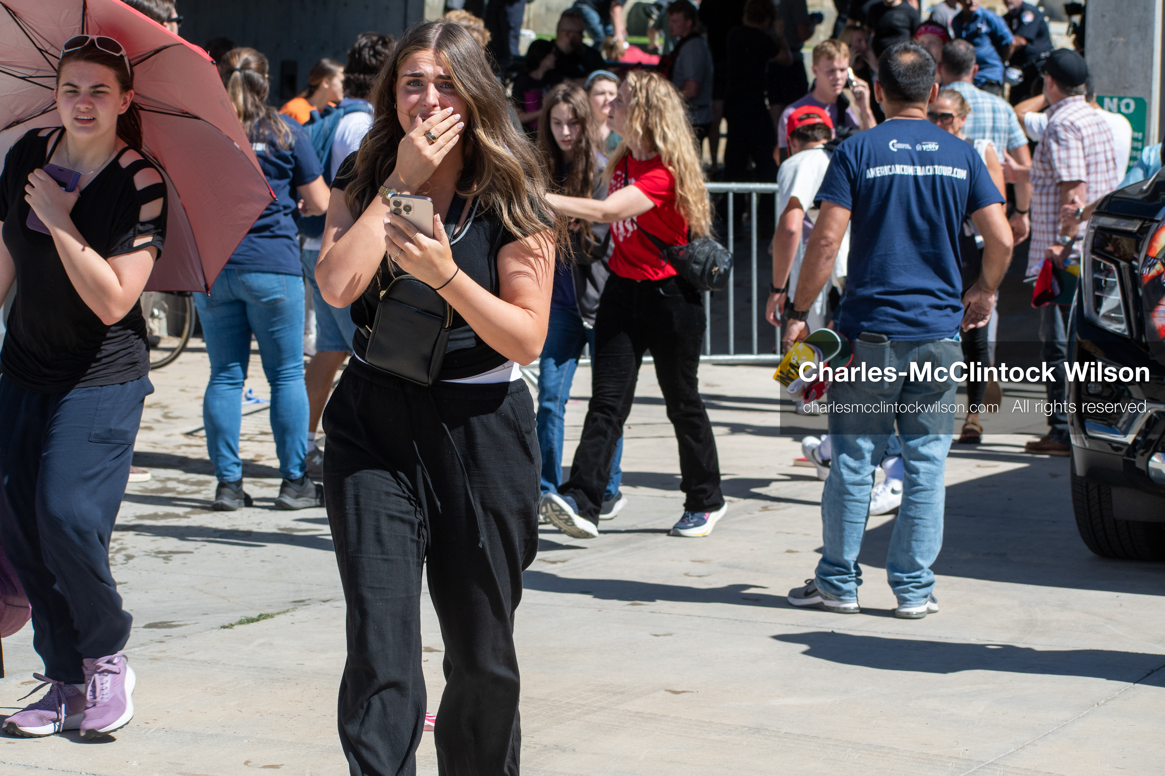 September 10, 2025, Orem, Utah, USA: Attendees flee the scene moments after conservative activist Charlie Kirk is shot during a public event at Utah Valley University. The shooting occurs during a Q&A session with students, approximately two minutes into the exchange. Kirk appears to be struck in the neck. The campus is evacuated as emergency protocols are activated. A university spokesperson states that no suspect is in custody at the time, though an earlier campus alert indicated that police had detained an individual. (Credit Image: © Charles-McClintock Wilson/ZUMA Press Wire)