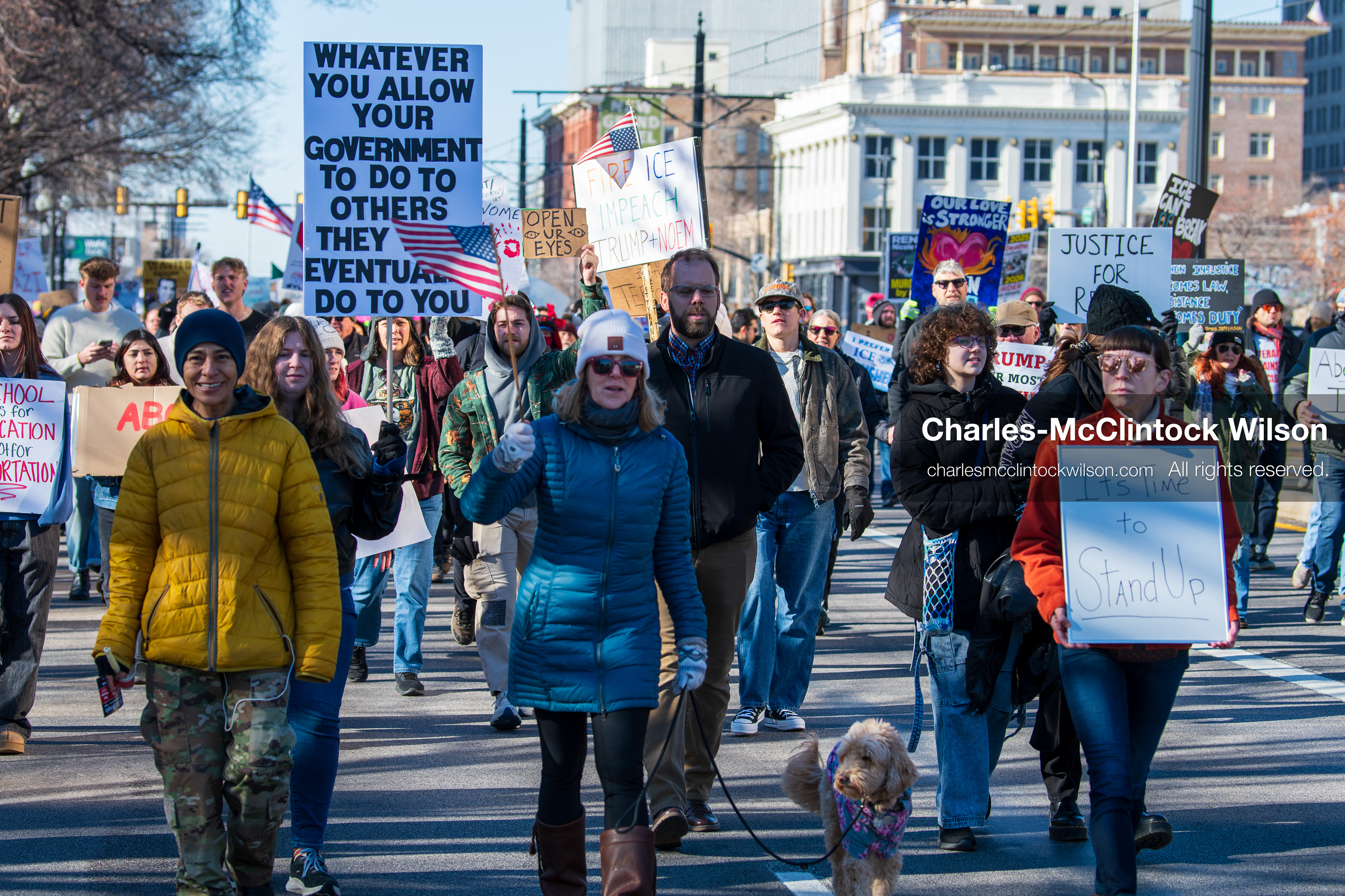 Salt Lake City, Utah, January 10, 2026: A group of demonstrators marches through downtown Salt Lake City during the ICE Out for Good protest, which began at Washington Square Park, with participants carrying signs and personal items as they walk together. (Credit Image: © Charles‑McClintock Wilson/ZUMA Press Wire)