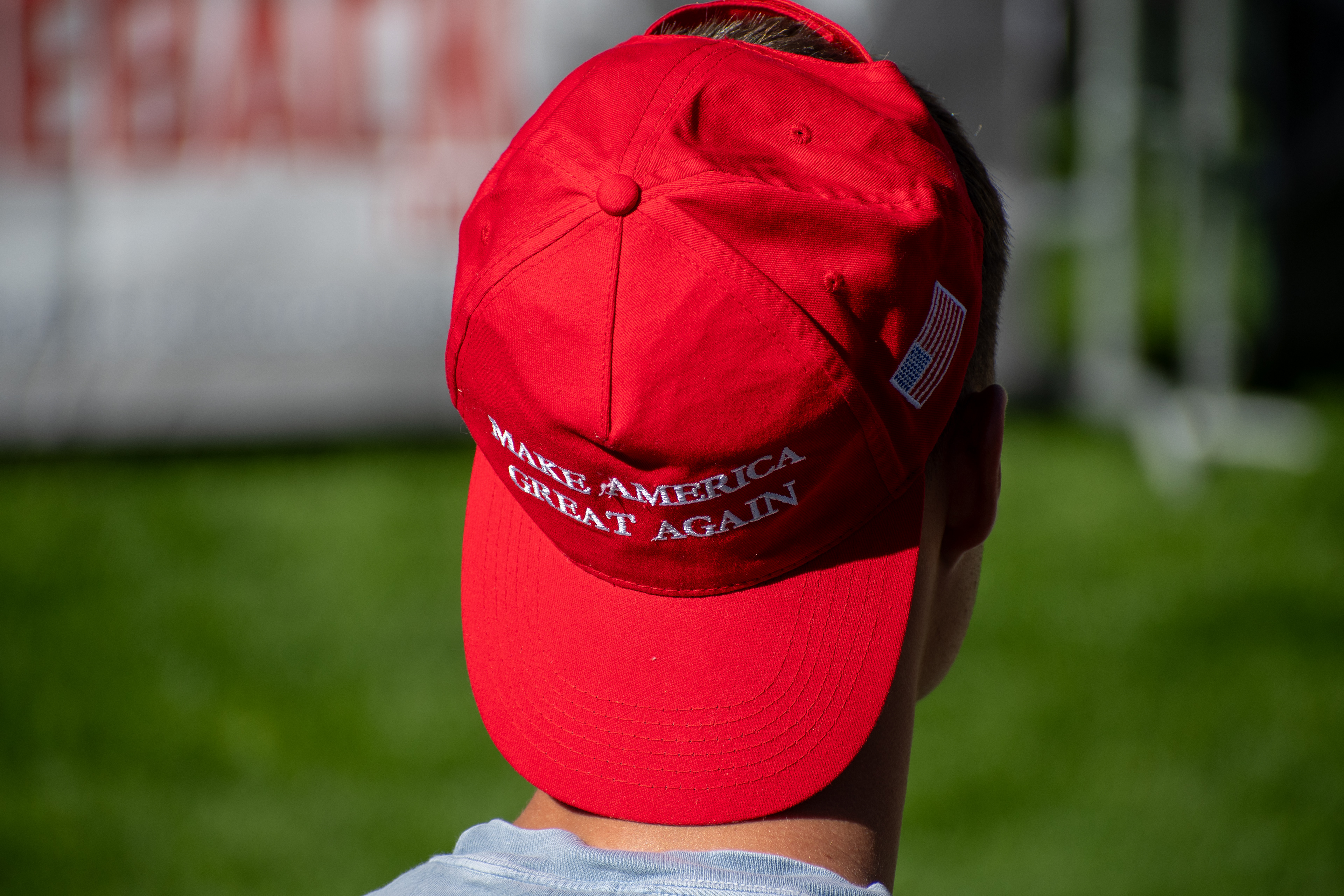 OREM, UTAH – SEPTEMBER 10, 2025: An attendee stands quietly on the lawn at Utah Valley University during the opening stop of the American Comeback Tour. Framed from behind, the image captures a moment of stillness and personal presence amid the larger gathering. It reflects the emotional texture and civic anticipation that shaped the event’s intended spirit. © Charles-McClintock Wilson / ZUMA Press