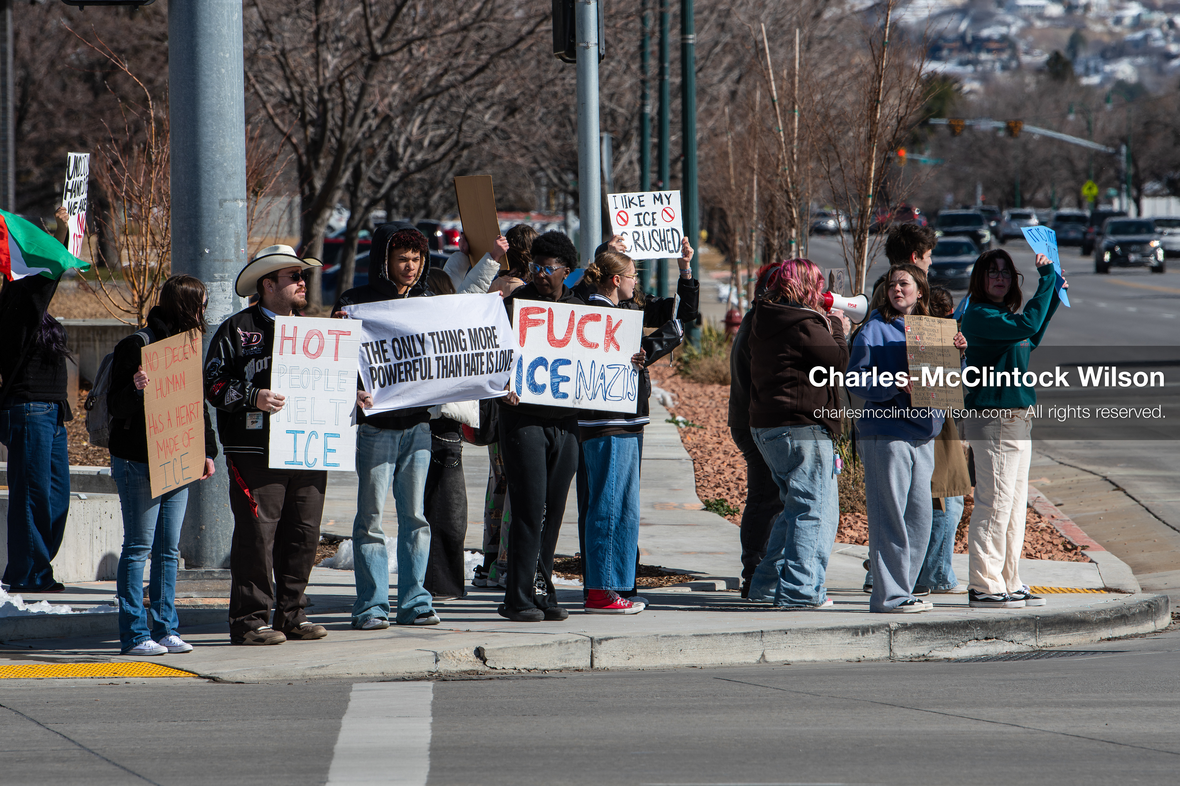 February 20, 2026, Orem, Utah, USA: High school students gather along State Street in front of Orem City Hall during a student led protest against ICE and federal immigration enforcement. Demonstrators hold signs as they stand near the roadway while traffic continues through the area. (Credit Image: © Charles McClintock Wilson/ZUMA Press Wire)