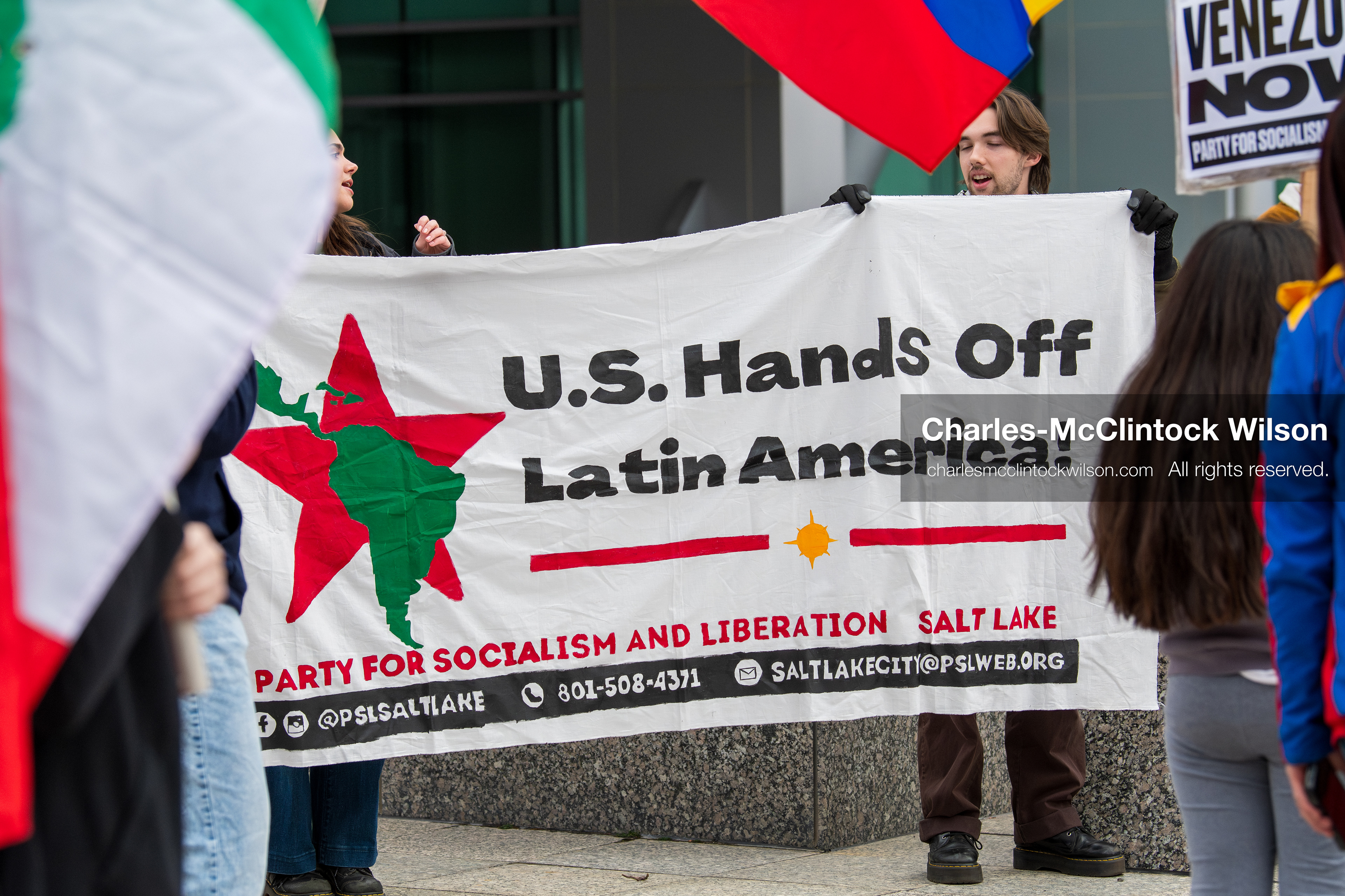 January 3, 2026, Salt Lake City, Utah, USA: Protesters display a banner during a demonstration against US action in Venezuela outside the Wallace Federal Building in Salt Lake City, Utah. The protest was part of a nationwide mobilization responding to recent military developments. (Credit Image: (c) Charles‑McClintock Wilson/ZUMA Press Wire)