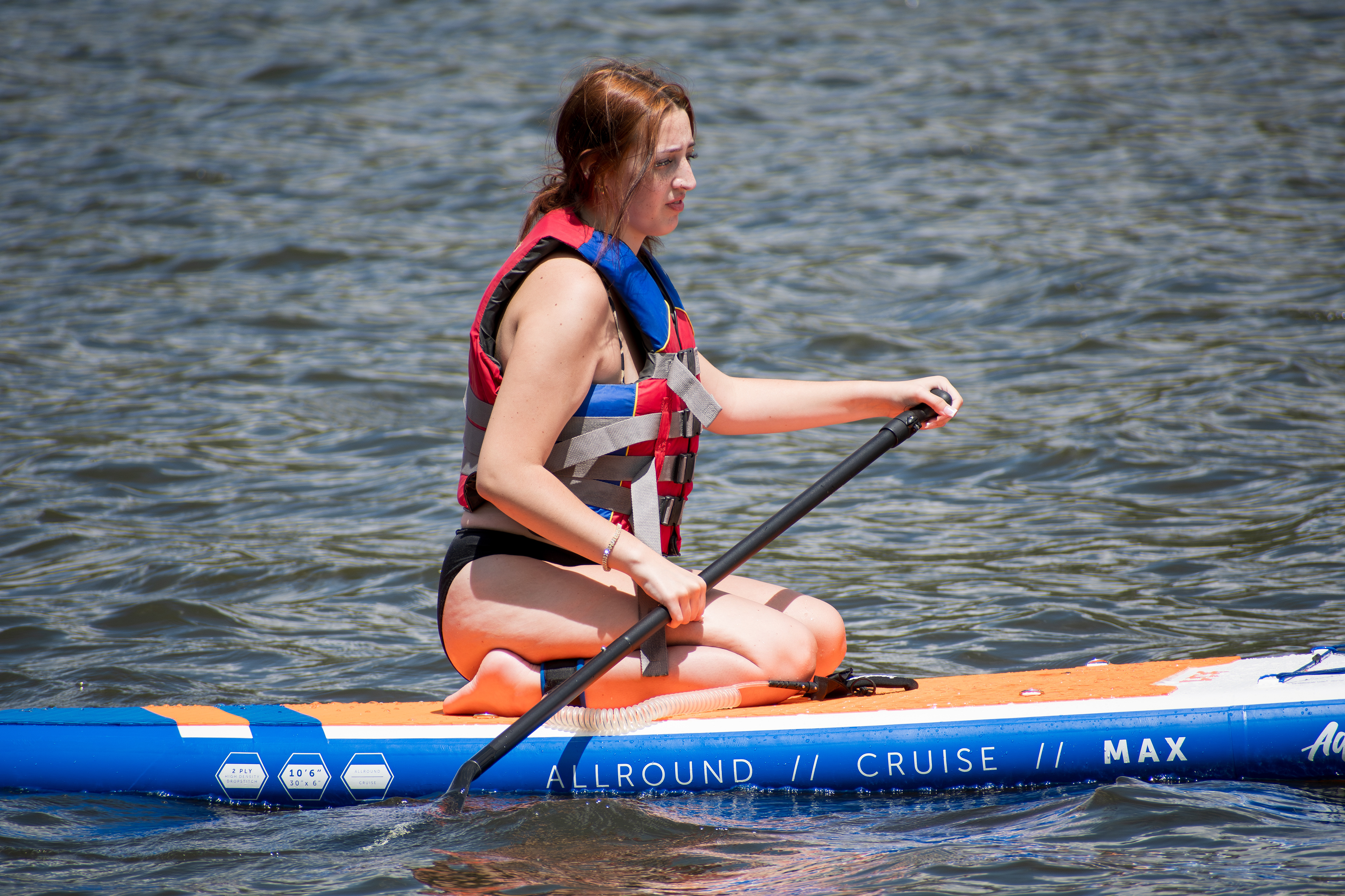 Summit County, Utah – July 20, 2025: A woman paddleboards across the water at Smith and Morehouse Reservoir. 