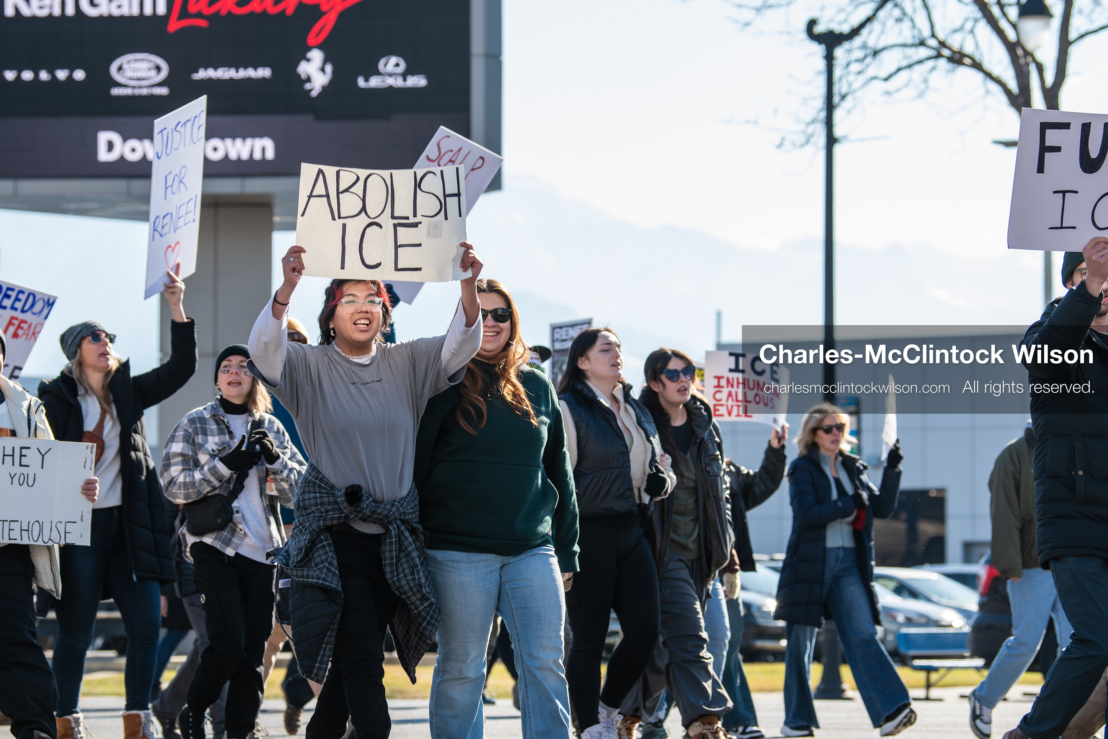 Salt Lake City, Utah, January 10, 2026: A group of demonstrators marches through downtown Salt Lake City during the ICE Out for Good protest, which began at Washington Square Park, with participants carrying signs and personal items as they walk together. (Credit Image: © Charles‑McClintock Wilson/ZUMA Press Wire)