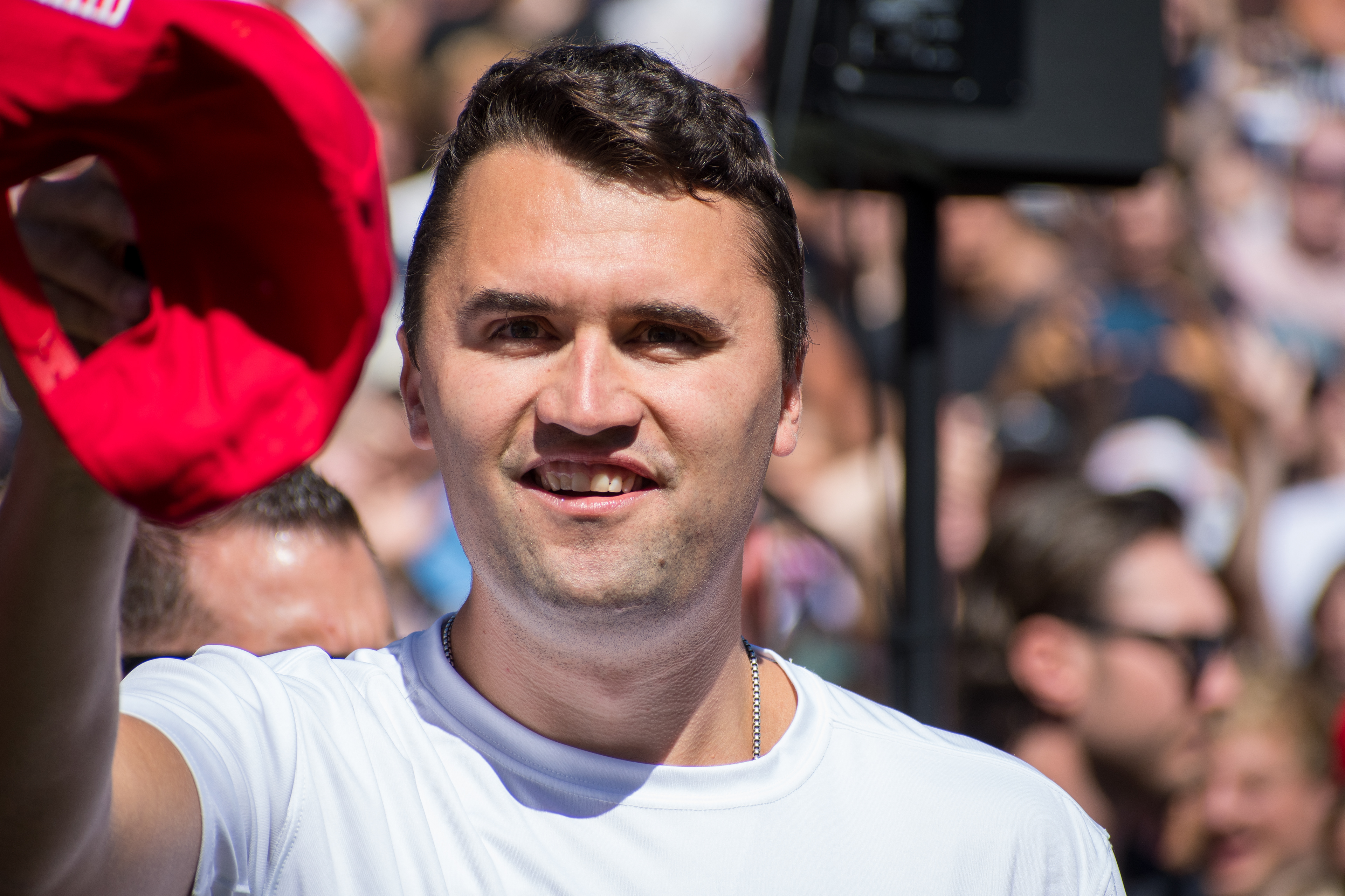 OREM, UTAH – SEPTEMBER 10, 2025: Charlie Kirk speaks with attendees during a public event at Utah Valley University. Positioned near a promotional booth and surrounded by supporters, Kirk appears engaged and expressive in one of his final public moments. The image reflects the atmosphere of direct outreach and energized dialogue that defined the gathering. © Charles-McClintock Wilson / ZUMA Press