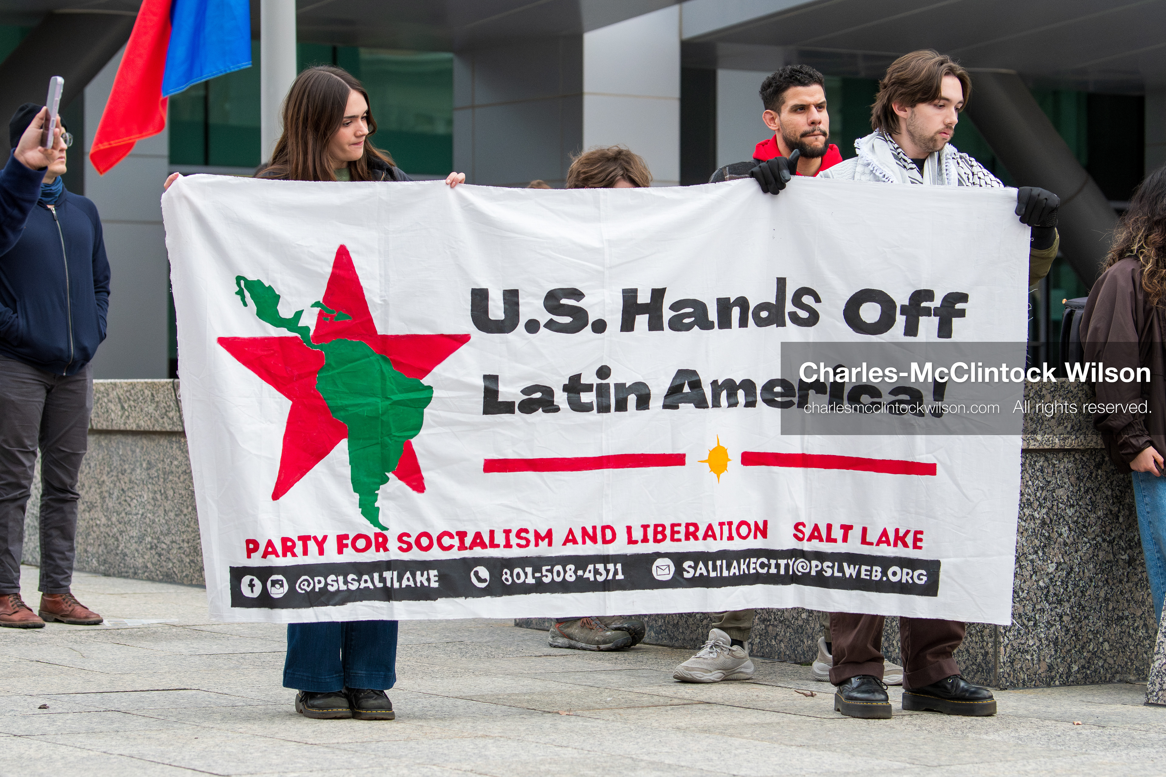 January 3, 2026, Salt Lake City, Utah, USA: Protesters display a banner during a demonstration against US action in Venezuela outside the Wallace Federal Building in Salt Lake City, Utah. The protest was part of a nationwide mobilization responding to recent military developments. (Credit Image: (c) Charles‑McClintock Wilson/ZUMA Press Wire)