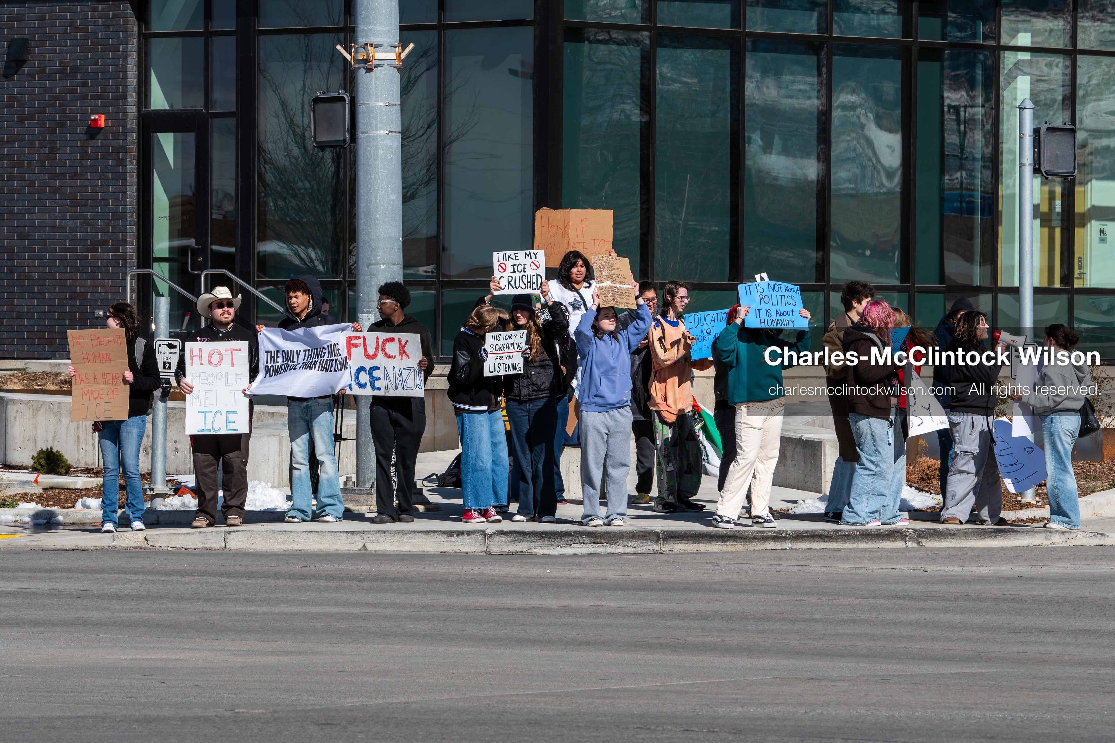 February 20, 2026, Orem, Utah, USA: High school students gather along State Street in front of Orem City Hall during a student led protest against ICE and federal immigration enforcement. Demonstrators hold signs as they stand near the roadway while traffic continues through the area. (Credit Image: © Charles McClintock Wilson/ZUMA Press Wire)