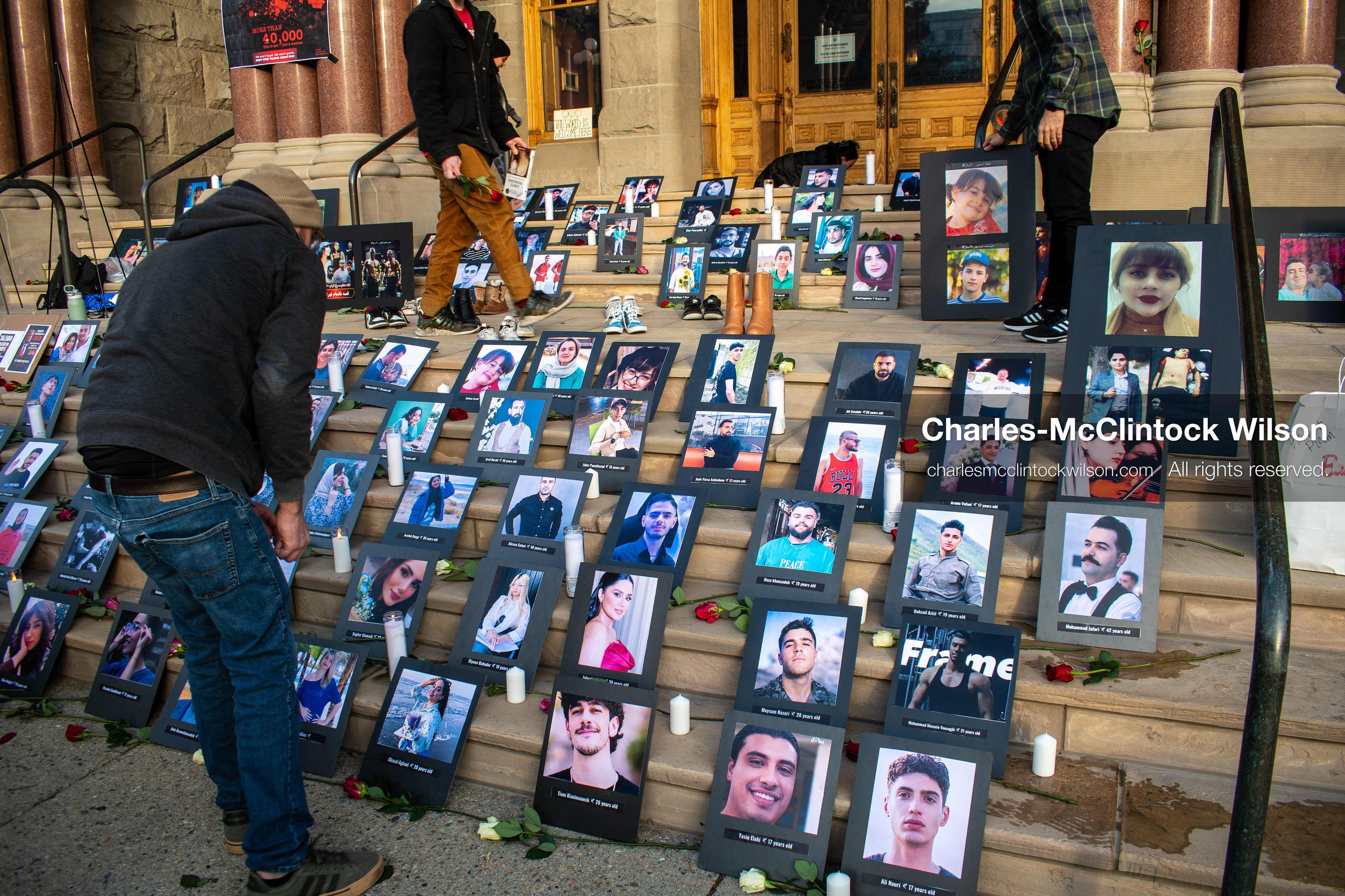 January 30, 2026, Salt Lake City, Utah, USA: People gather around portraits, candles, and flowers arranged on the steps of the Salt Lake City and County Building during a vigil honoring victims of the Iranian government. (Credit Image: © Charles McClintock Wilson/ZUMA Press Wire)