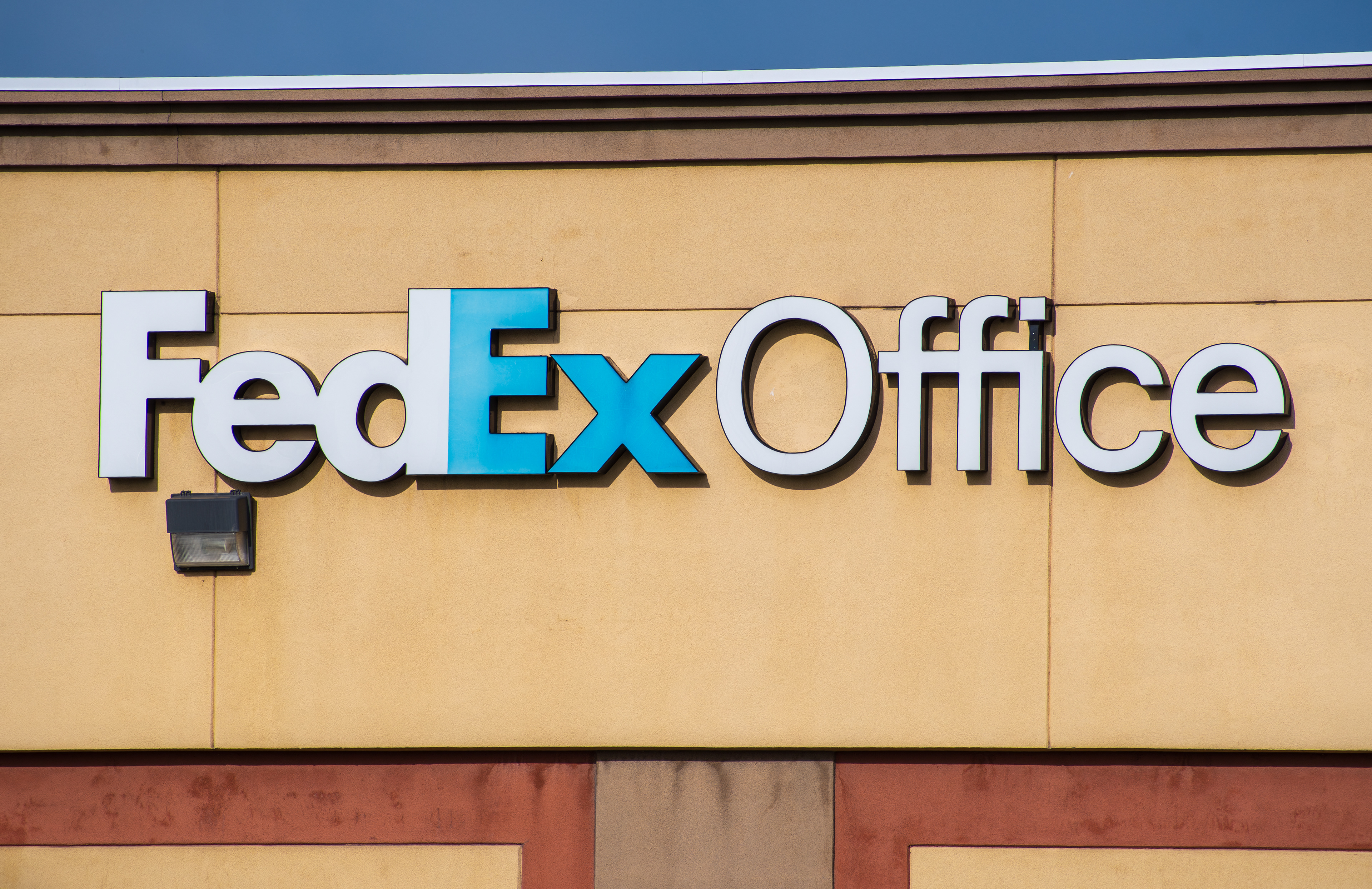 Spanish Fork, Utah, USA – May 28, 2025: Exterior of a FedEx Office store in Spanish Fork, Utah. The location offers printing, shipping, and business services to local customers and businesses.