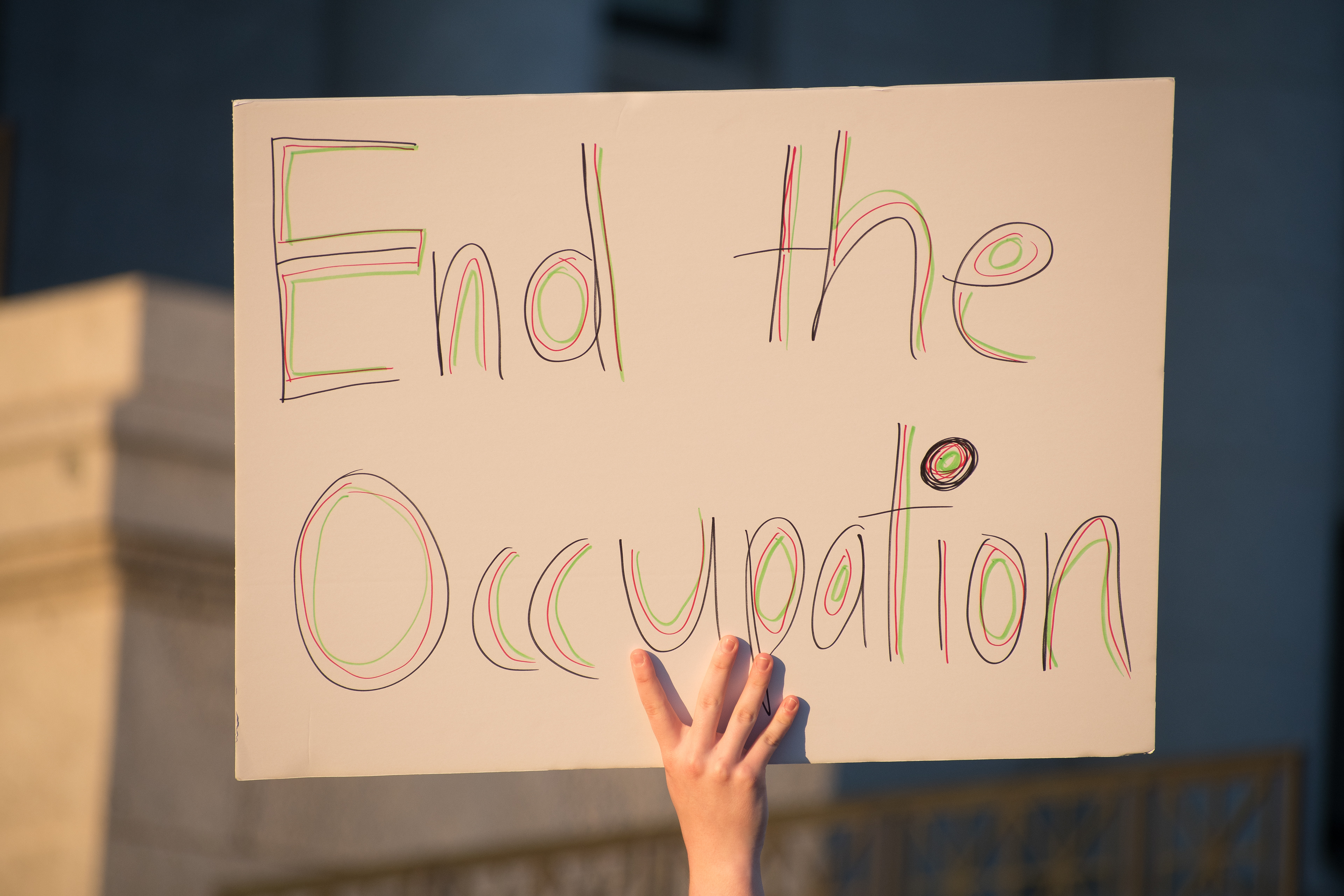  October 10, 2025, Salt Lake City, Utah, USA: A protester holds a sign reading â€œEnd the Occupationâ€ during the Free Palestine Rally organized in front of the Utah State Capitol. (Credit Image: © Charles-McClintock Wilson/ZUMA Press Wire)