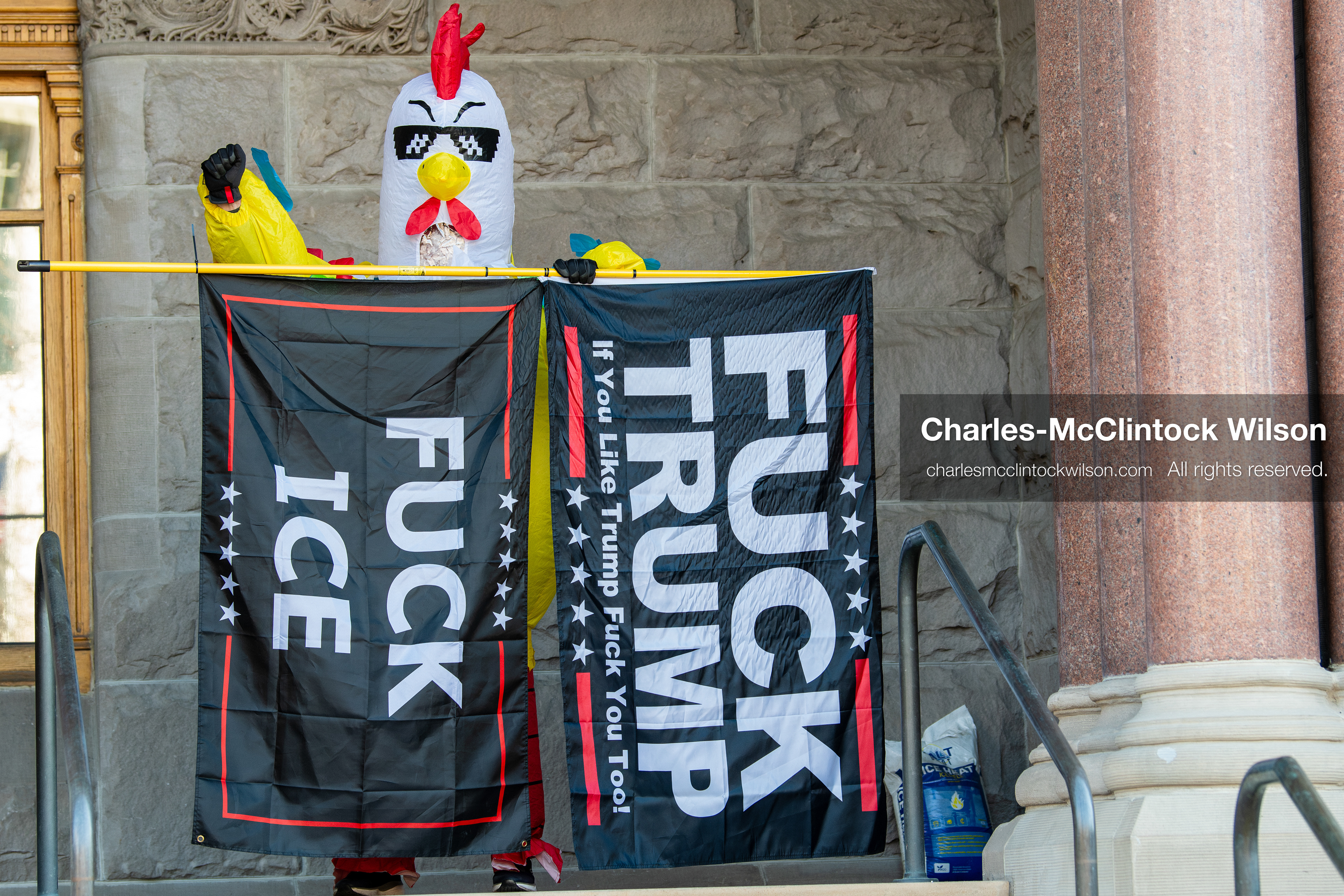 Salt Lake City, Utah, January 10, 2026: A protester wearing a chicken costume holds flags with anti‑ICE and anti‑Trump messaging during the ICE Out for Good protest at Washington Square Park, a demonstration calling for justice for Renee Nicole Good. (Credit Image: © Charles‑McClintock Wilson/ZUMA Press Wire)