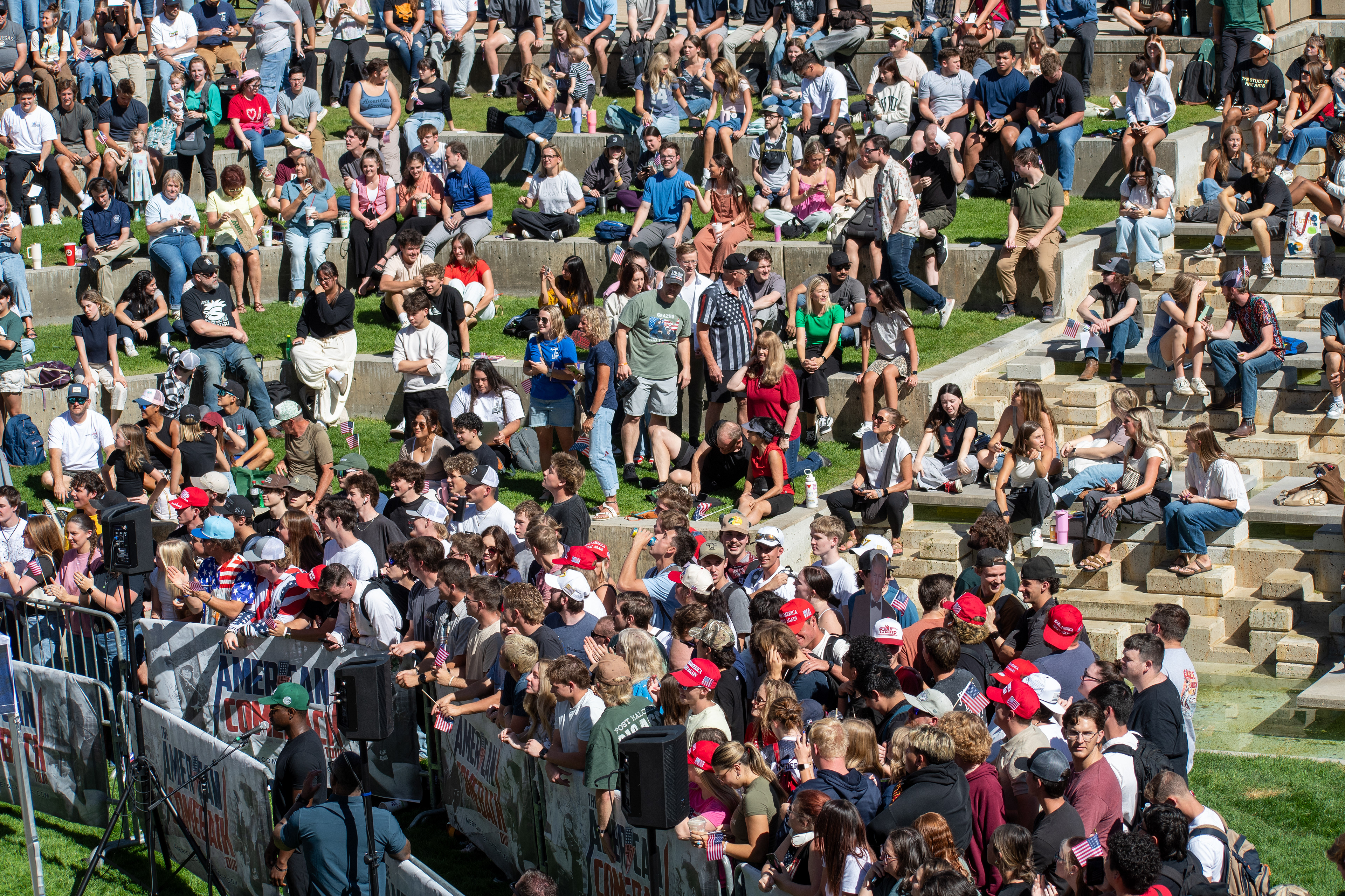OREM, UTAH – SEPTEMBER 10, 2025: Attendees gather across the lawn and walkways at Utah Valley University during the opening stop of the American Comeback Tour. Seated and standing in casual formation, the crowd reflects a moment of civic presence, curiosity, and communal engagement. The image captures the spatial texture and emotional tone of a public event designed to connect, energize, and engage. © Charles-McClintock Wilson / ZUMA Press