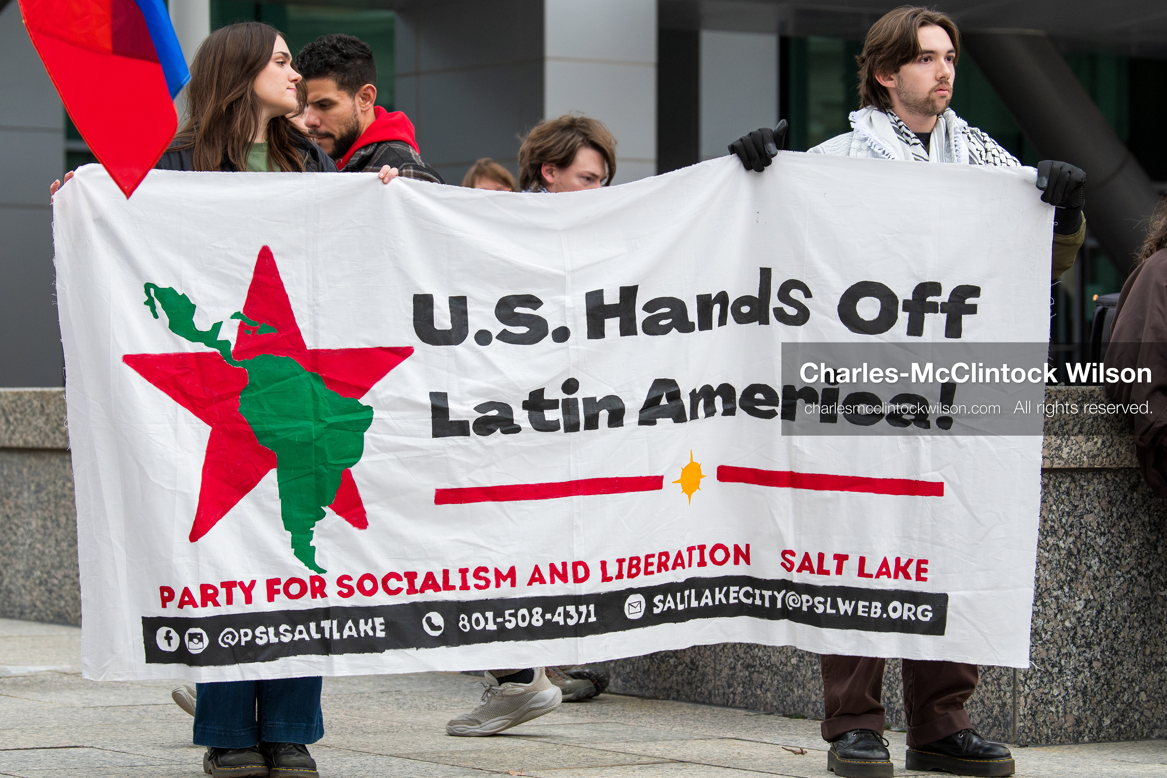 January 3, 2026, Salt Lake City, Utah, USA: Protesters display a banner during a demonstration against US action in Venezuela outside the Wallace Federal Building in Salt Lake City, Utah. The protest was part of a nationwide mobilization responding to recent military developments. (Credit Image: (c) Charles‑McClintock Wilson/ZUMA Press Wire)