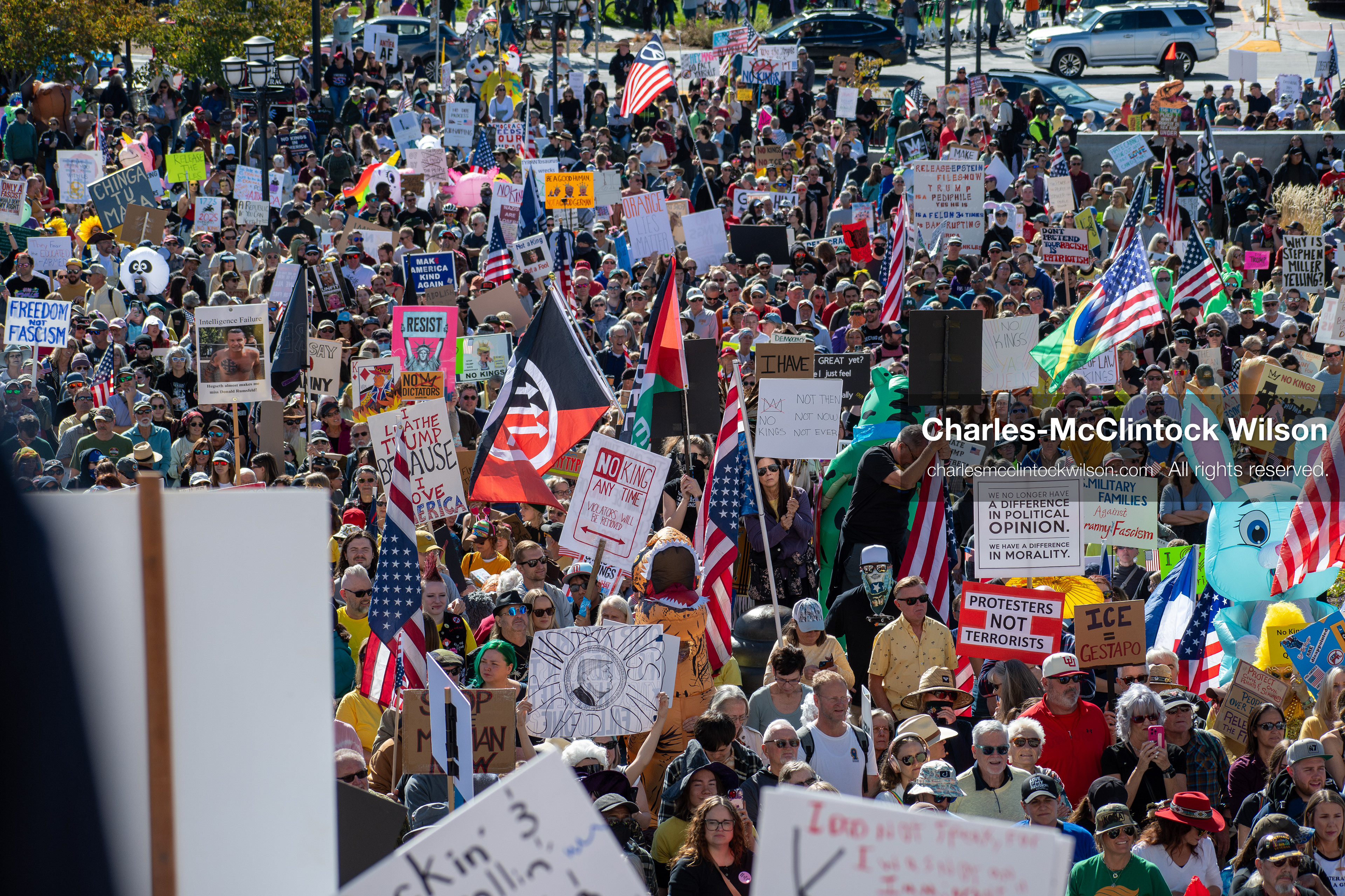 October 18, 2025, Salt Lake City, Utah, USA: Demonstrators participate in a "No Kings" protest held at the Utah State Capitol. Participants hold signs and flags during the public gathering.