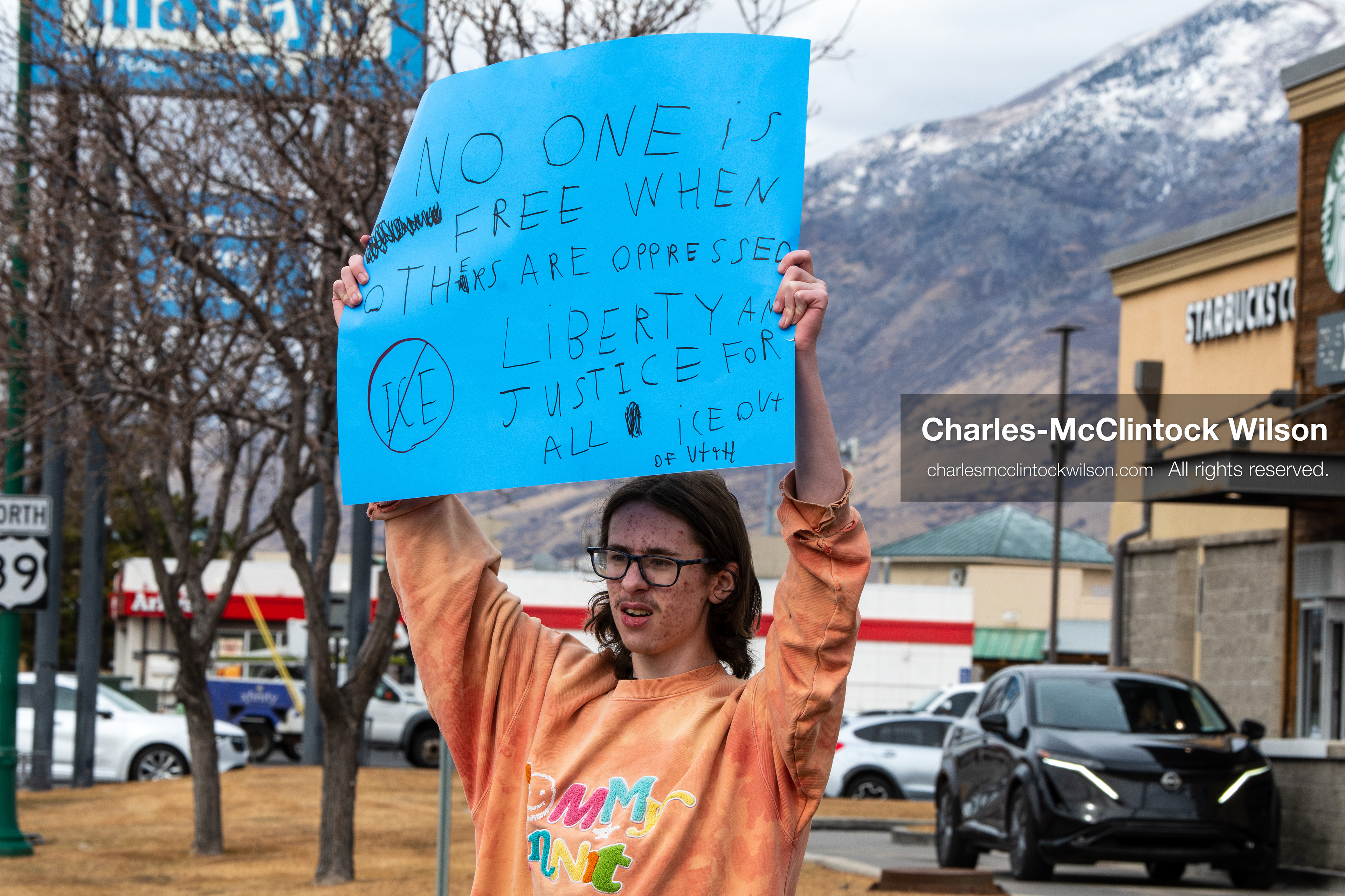 February 11, 2026, Orem, Utah, USA: A student stands along State Street during a student‑led protest involving participants from multiple Orem schools. (Credit Image: © Charles‑McClintock Wilson/ZUMA Press Wire)
