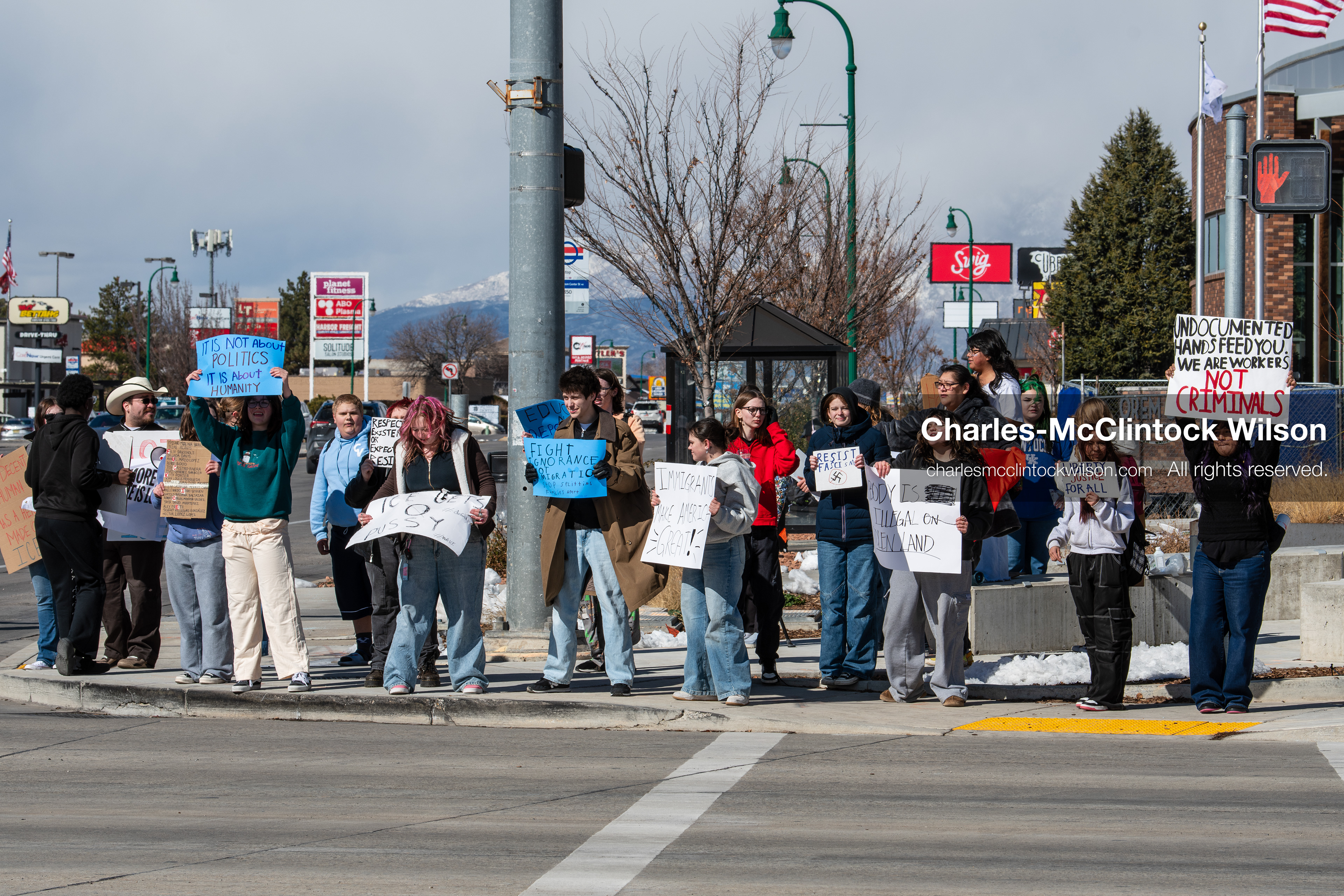 February 20, 2026, Orem, Utah, USA: High school students gather along State Street in front of Orem City Hall during a student led protest against ICE and federal immigration enforcement. Demonstrators hold signs as they stand near the roadway while traffic continues through the area. (Credit Image: © Charles McClintock Wilson/ZUMA Press Wire)